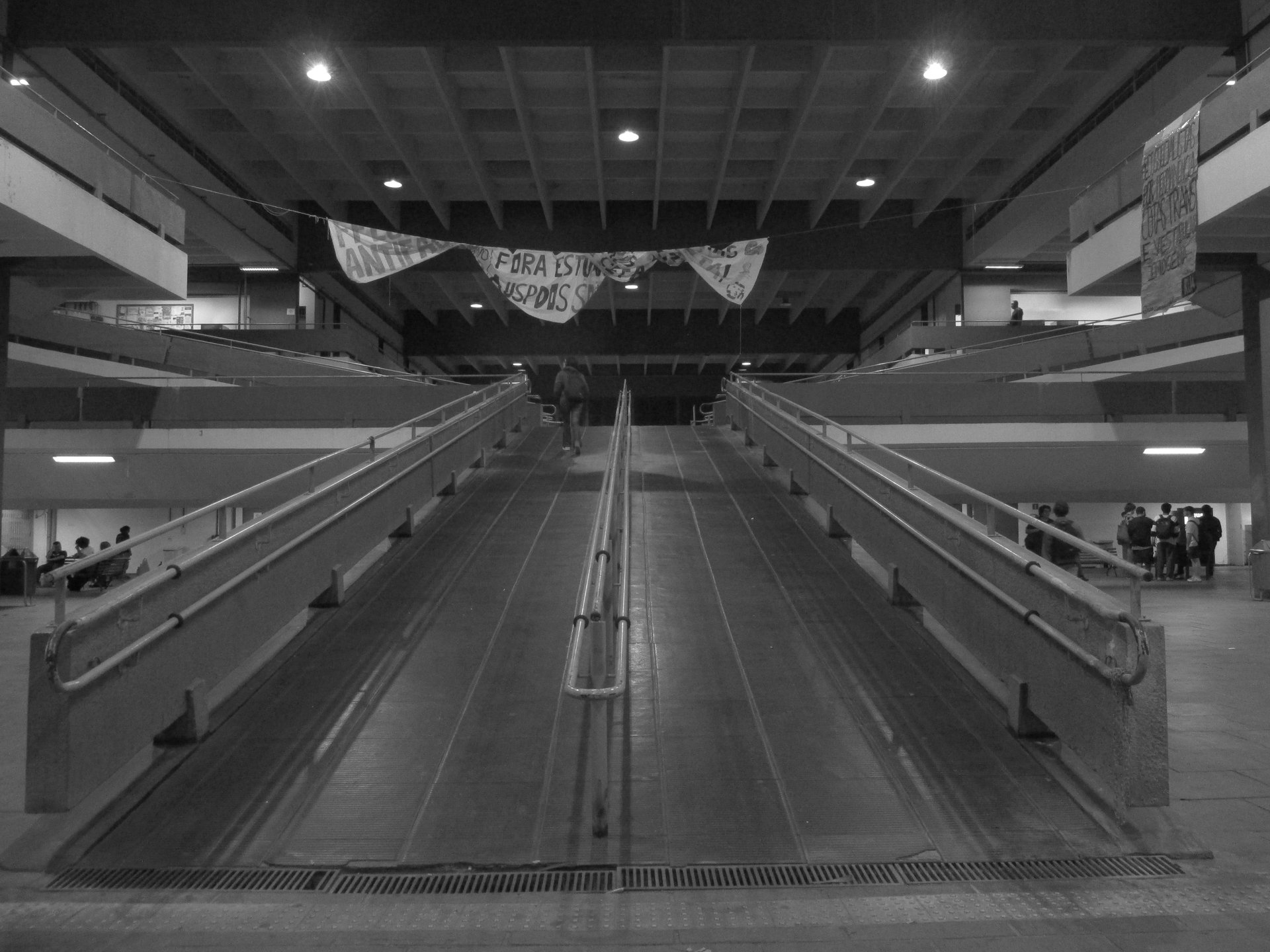 an abstract photo of a curved building with a blue sky in the background