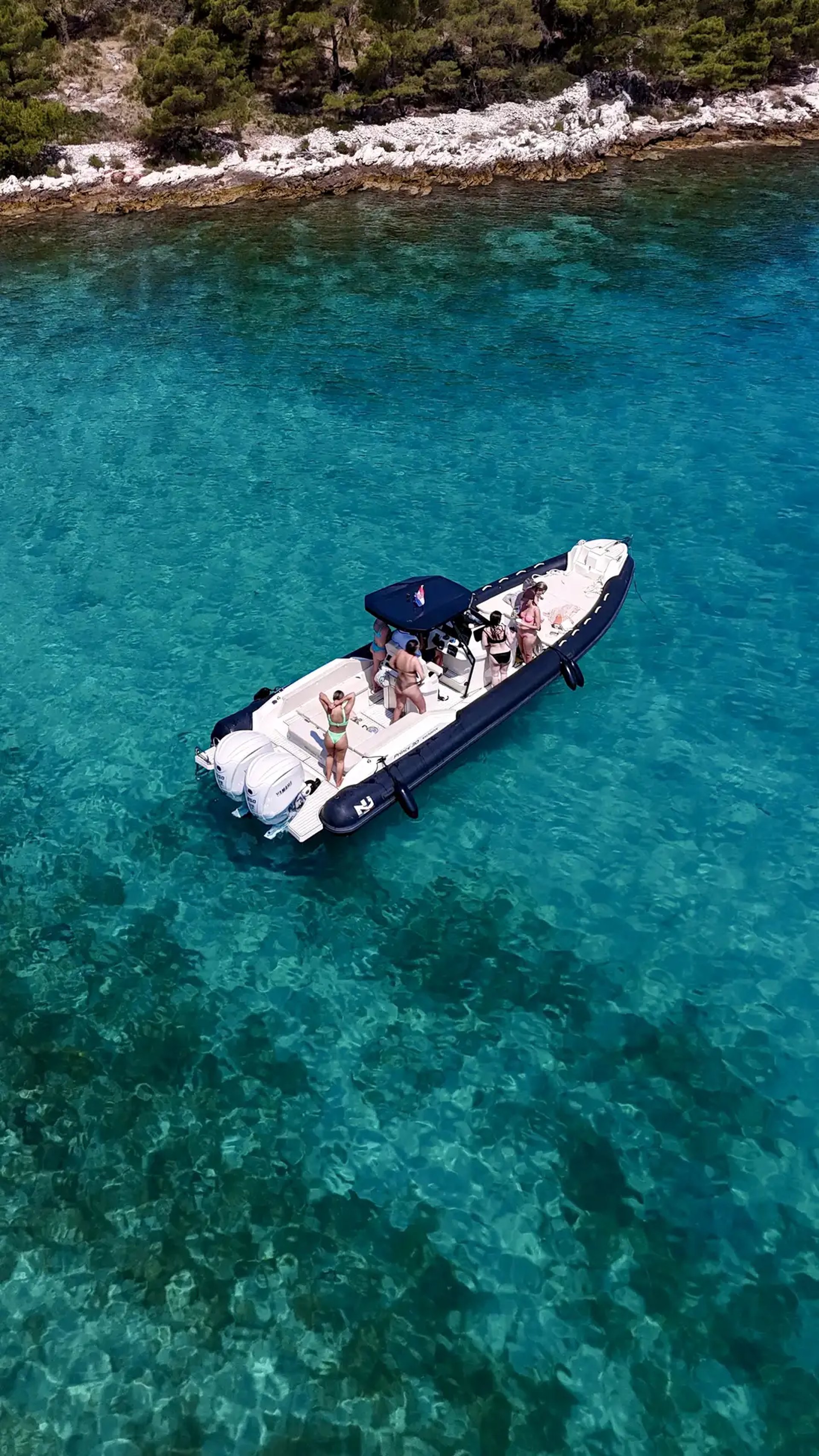 Nuova Jolly speedboat in Milna, Brac. Girls enjoying a private boat tour from Split with SunMarine.