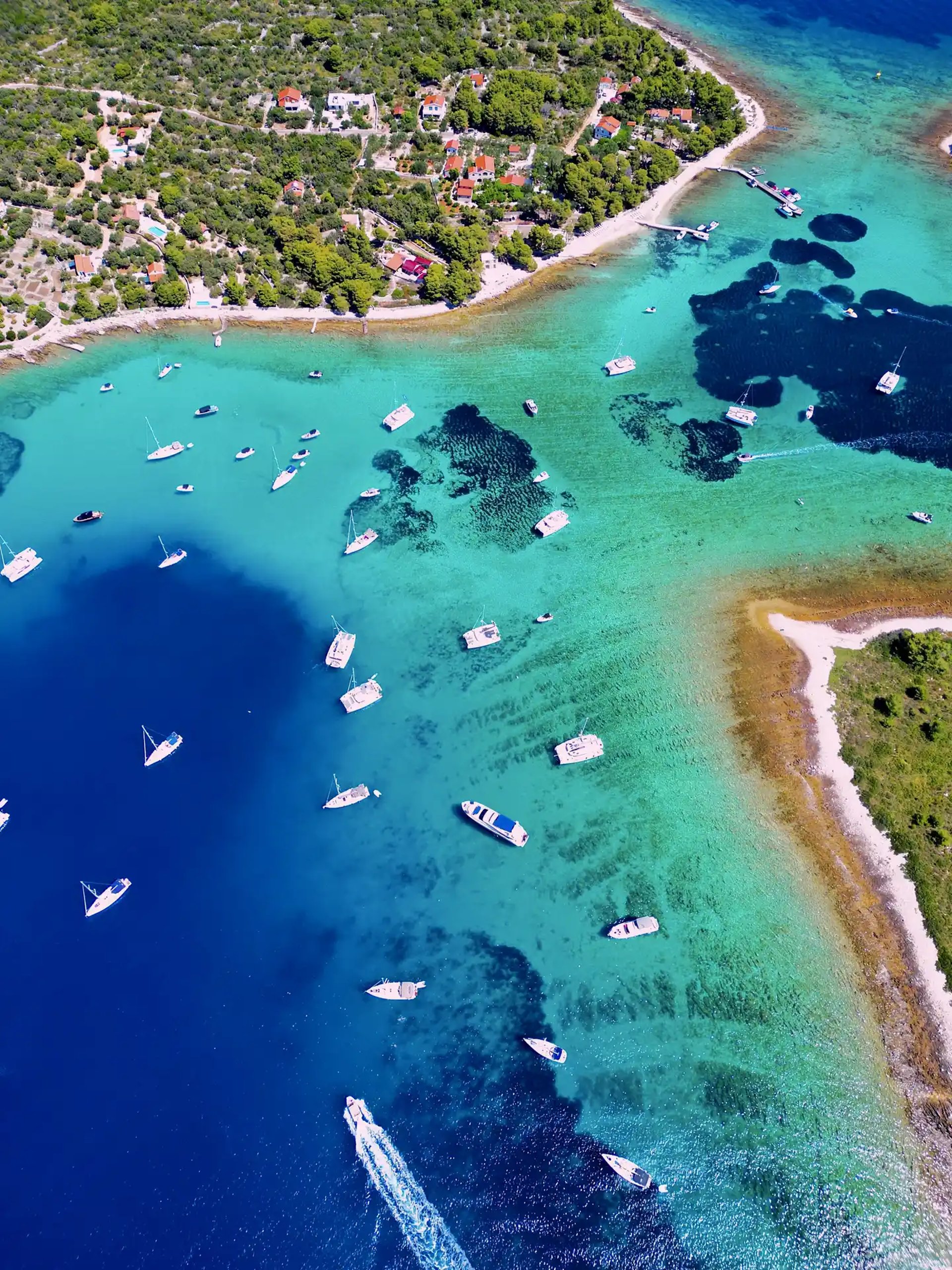 Aerial panoramic view of Blue Lagoon at Drvenik Veliki Island, seen on a private boat tour from Split, Croatia.