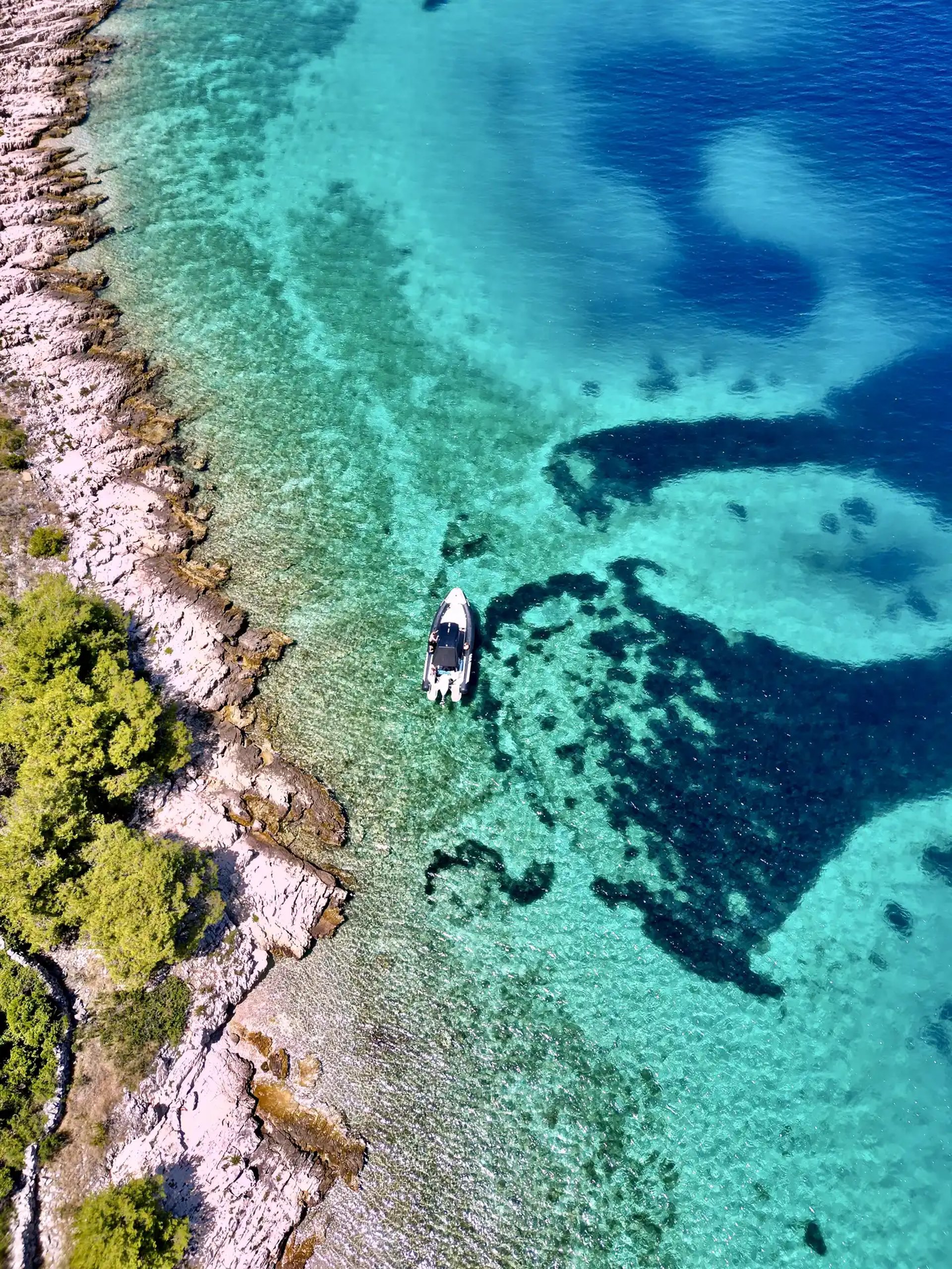 Aerial panoramic view of Drvenik Mali Island, seen on a private boat tour off the coast of Split, Croatia.