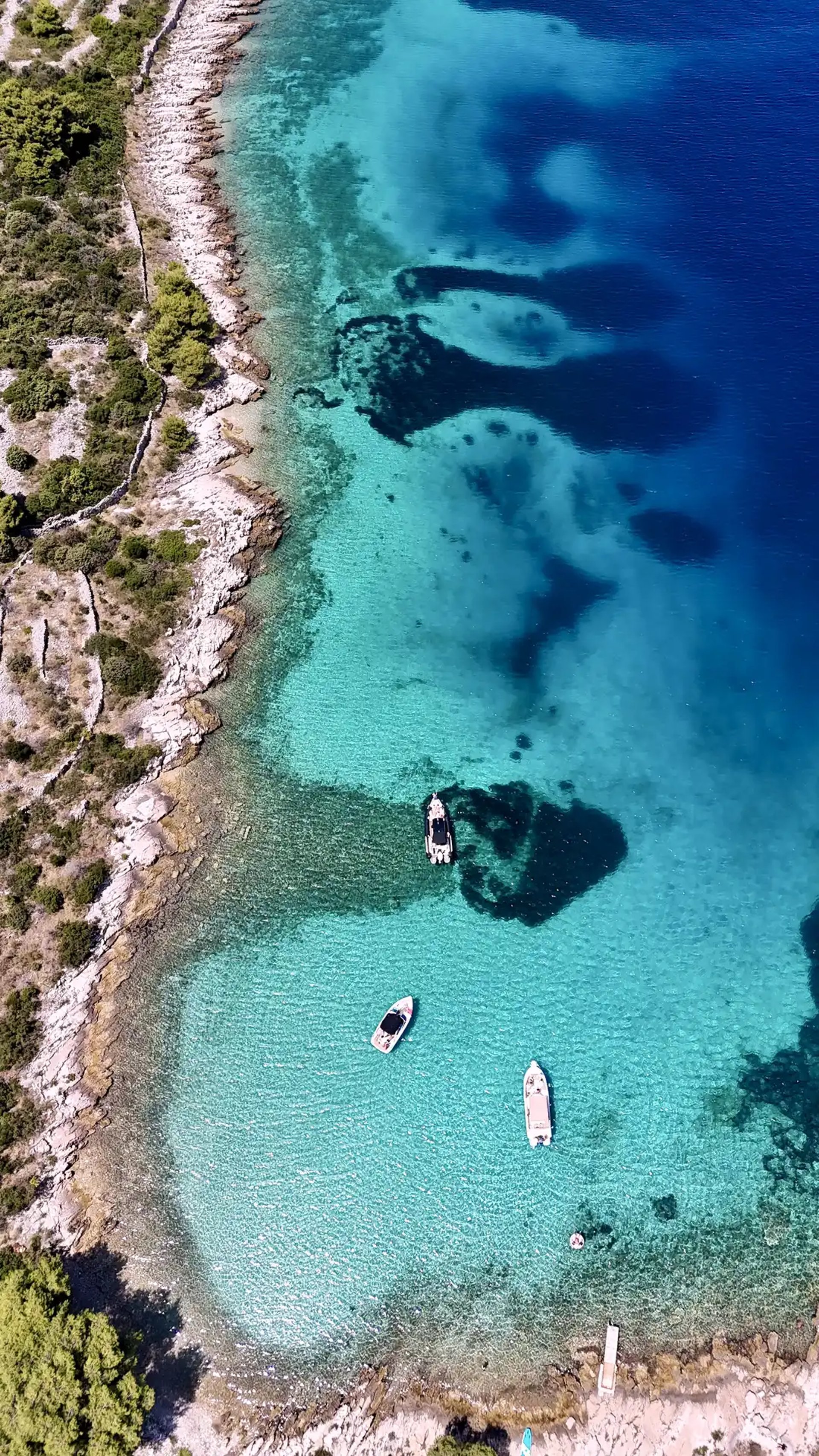 Aerial panoramic view of Drvenik Mali Island, seen on a private boat tour off the coast of Split, Croatia.