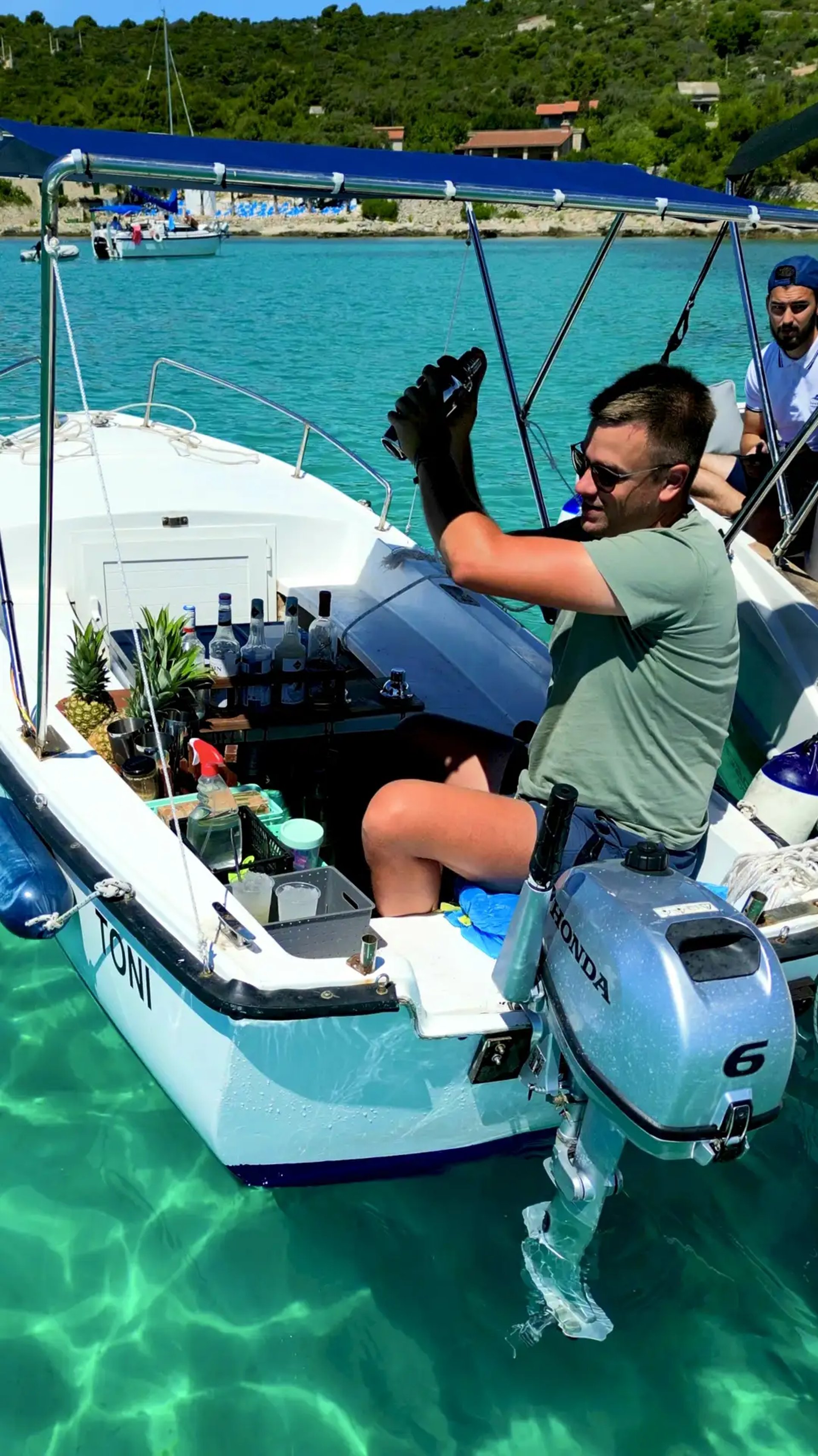 Mojito guy preparing fresh cocktails on a boat at Blue Lagoon, Croatia during a private boat tour from Split
