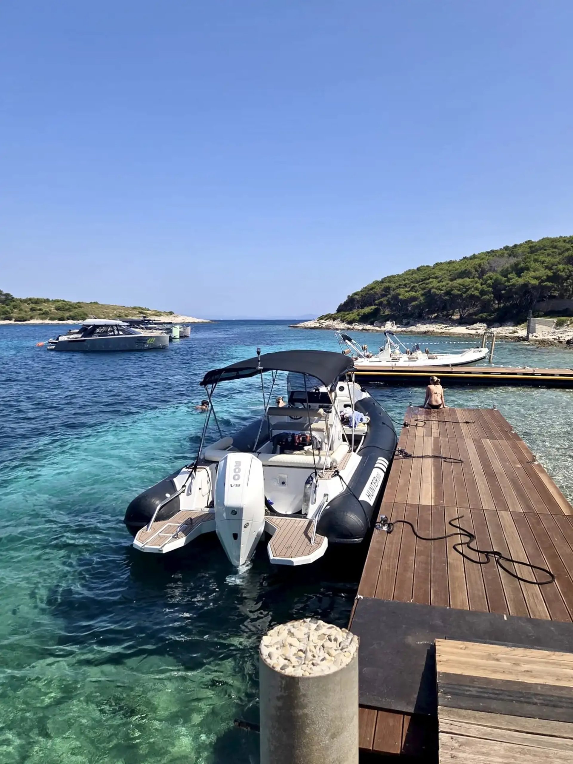 Hunter Pro 800 RIB speedboat docked at a pontoon in Pakleni Islands during a private boat tour from Split, Croatia