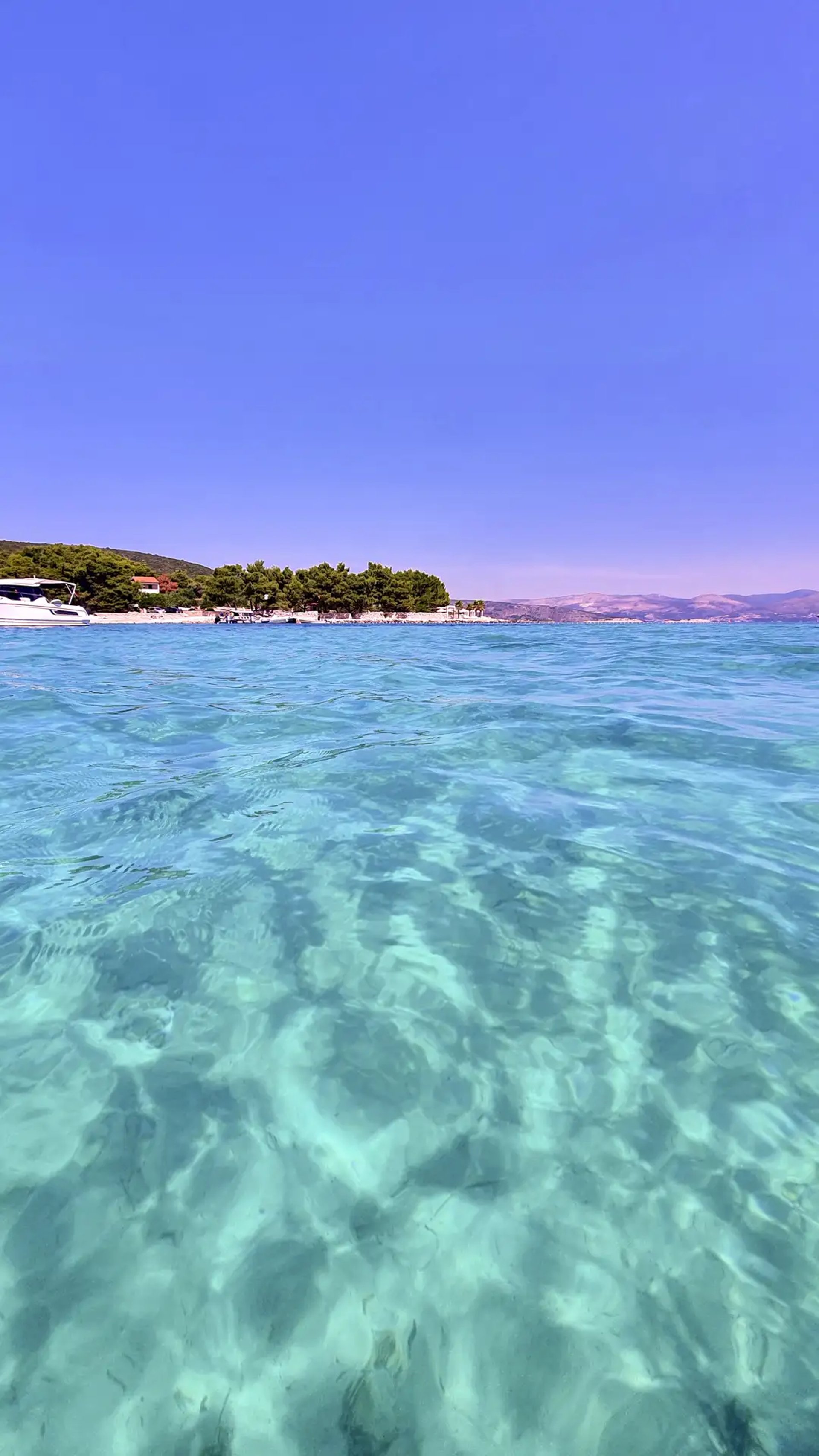 Stunning turquoise and crystal-clear sea at Blue Lagoon, Croatia on a private boat tour from Split