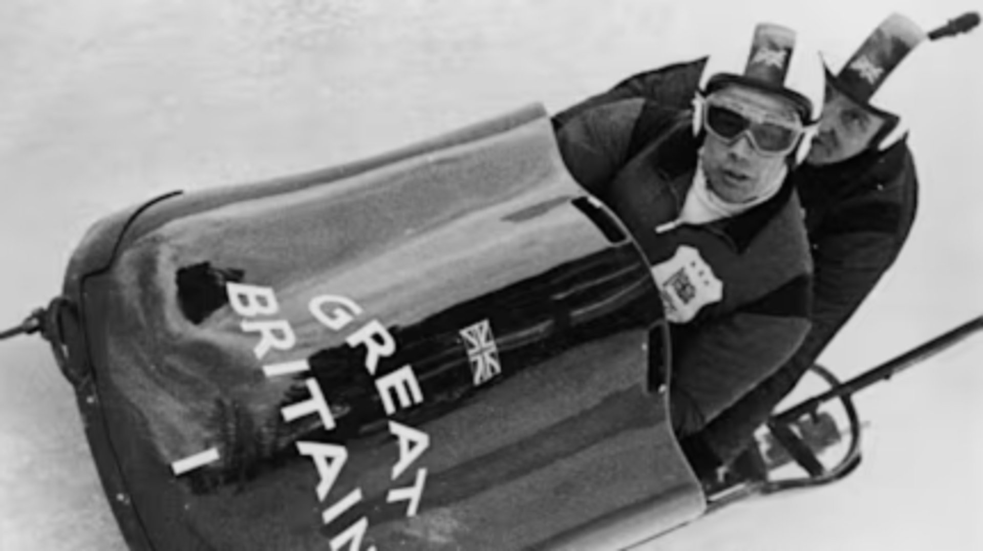 a black and white photo of a snow covered mountain