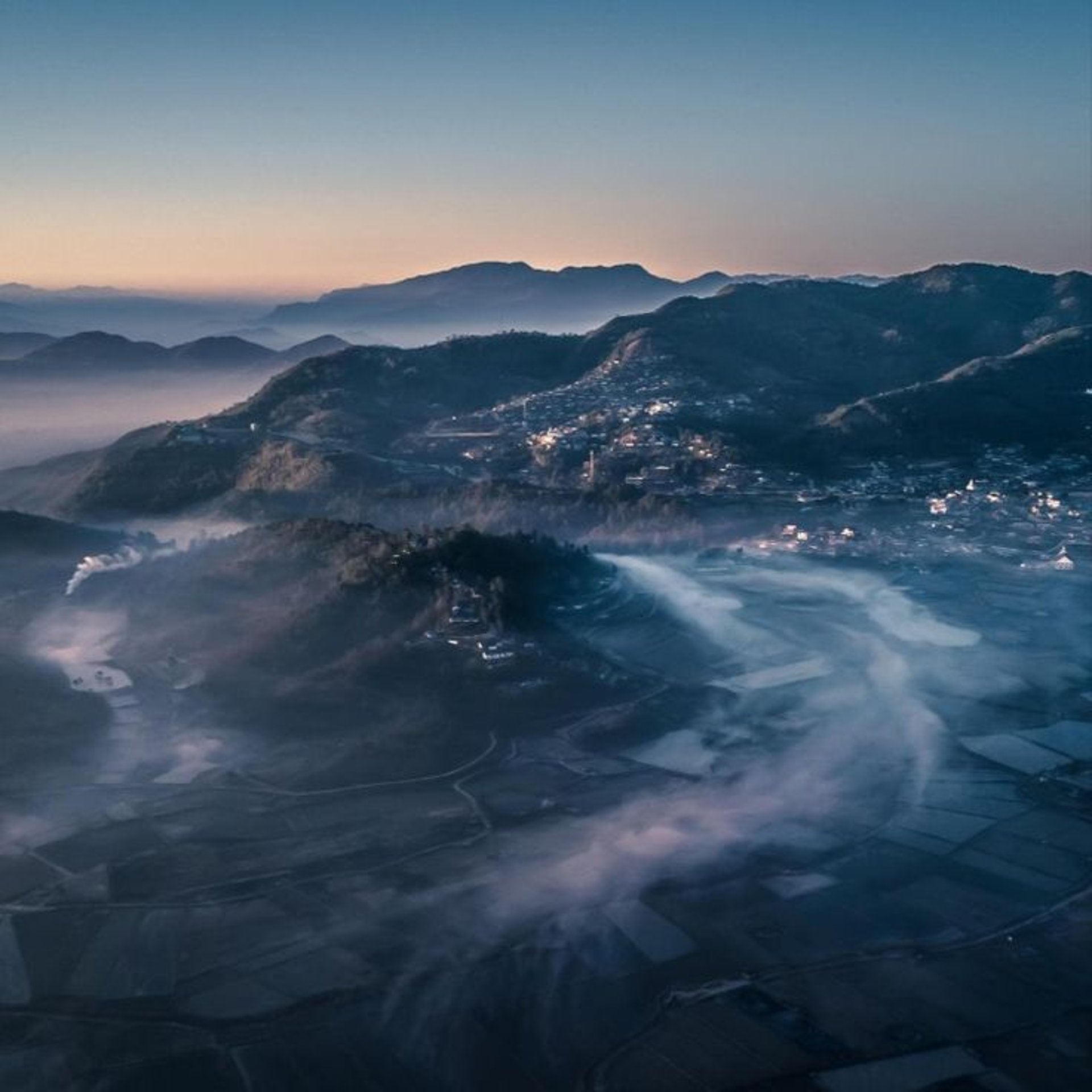 woman wearing yellow long-sleeved dress under white clouds and blue sky during daytime