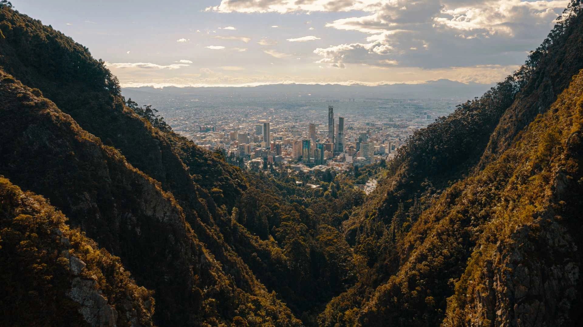 Panoramic view of Bogota cityscape at sunset from Monserrate Mountain during an exclusive private tour.