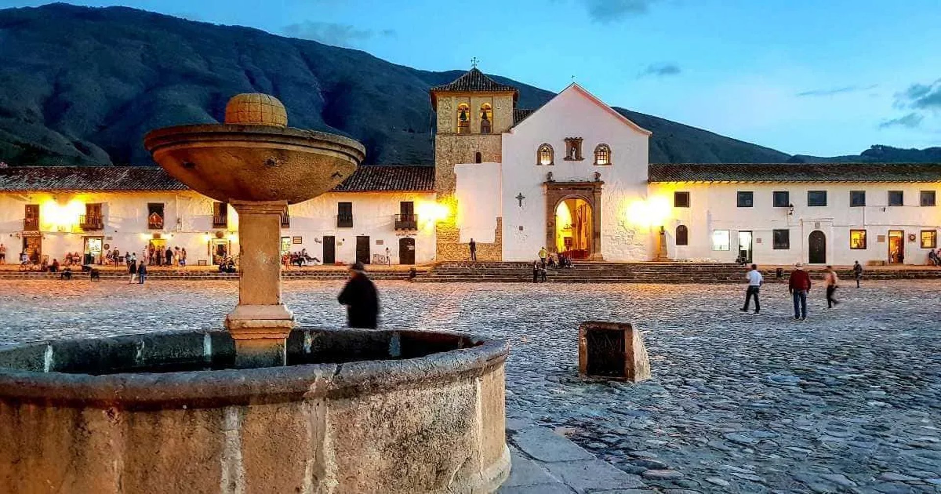 Warm sunset view of the historic colonial main square and cathedral during a private Villa de Leyva tour