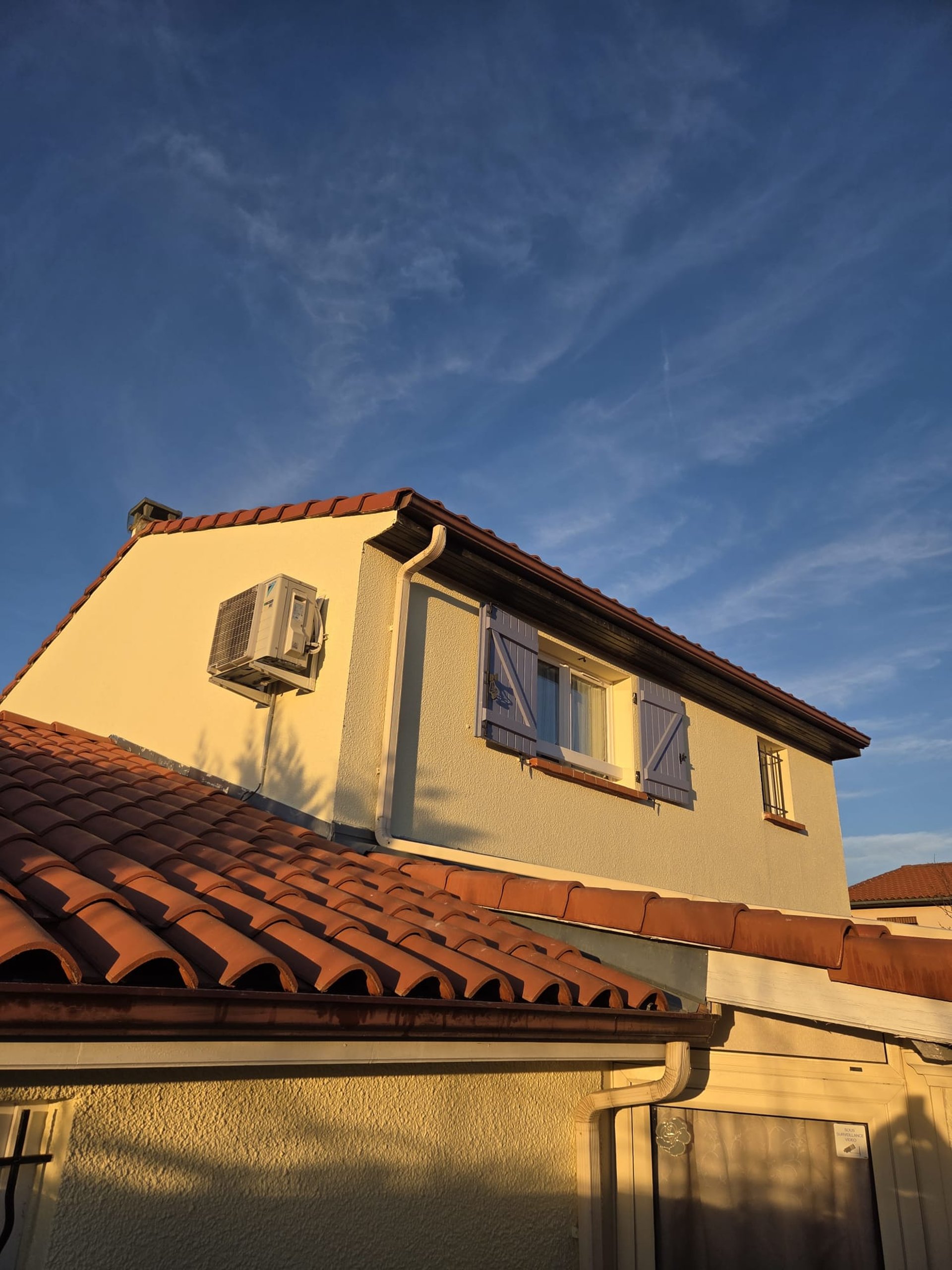 an abstract photo of a curved building with a blue sky in the background