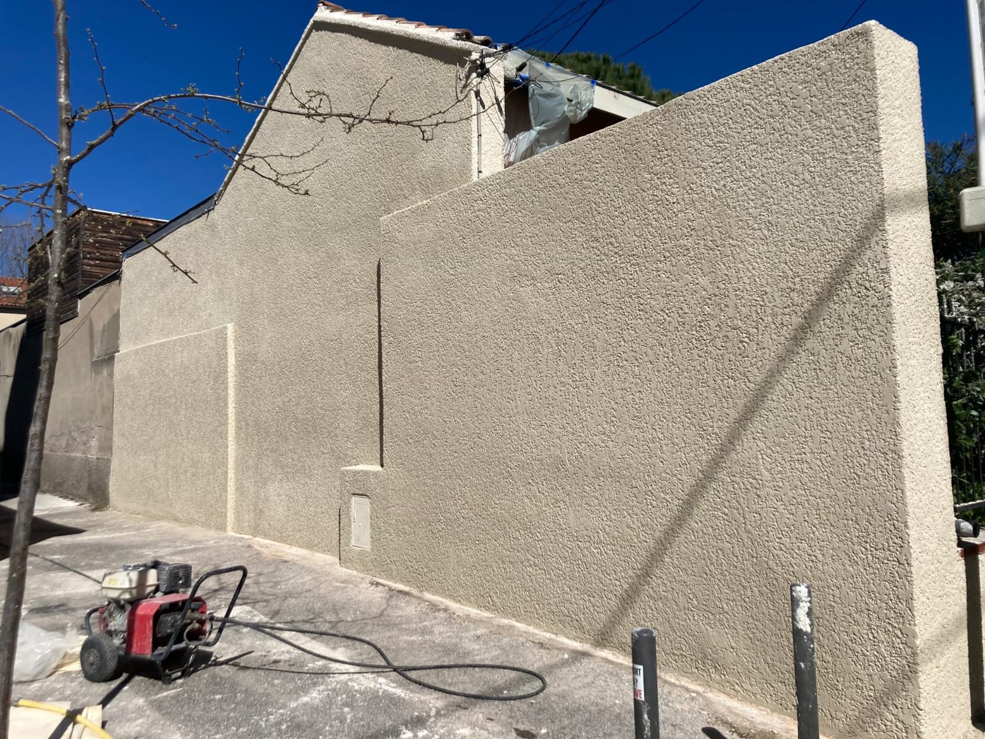 an abstract photo of a curved building with a blue sky in the background