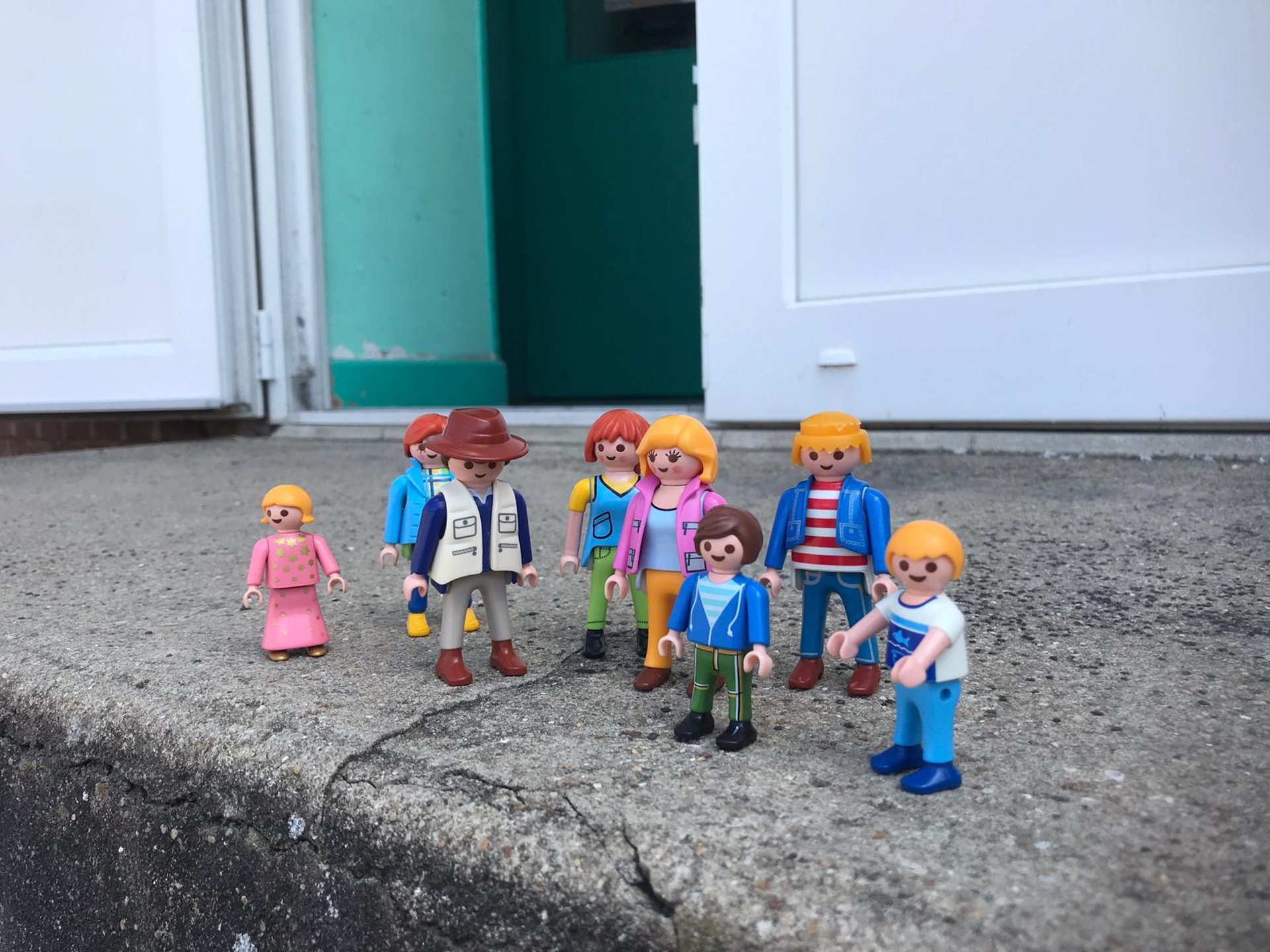 selective focus photography of woman holding yellow petaled flowers