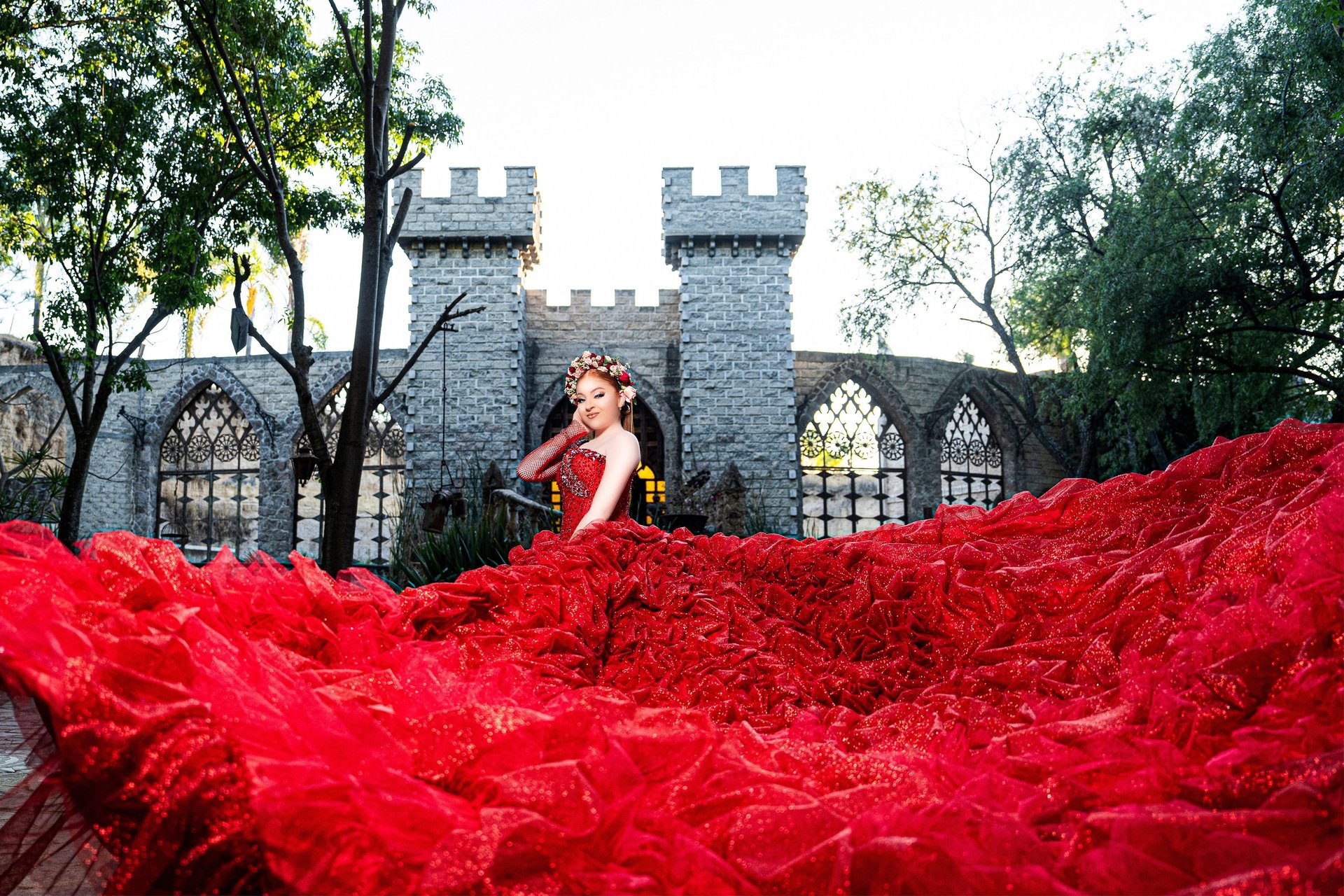 Young woman in a light blue gown holding a bouquet