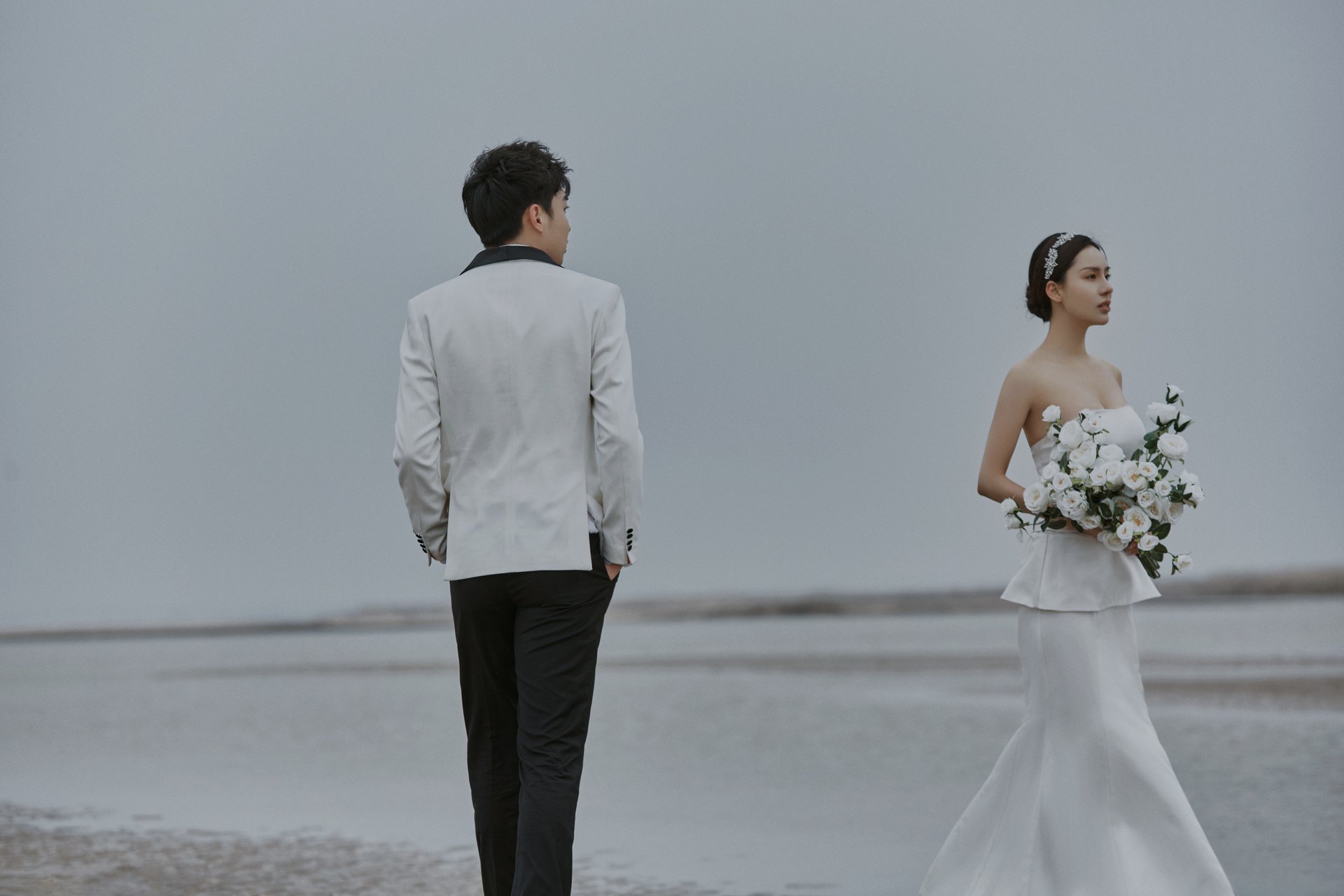 an abstract photo of a curved building with a blue sky in the background
