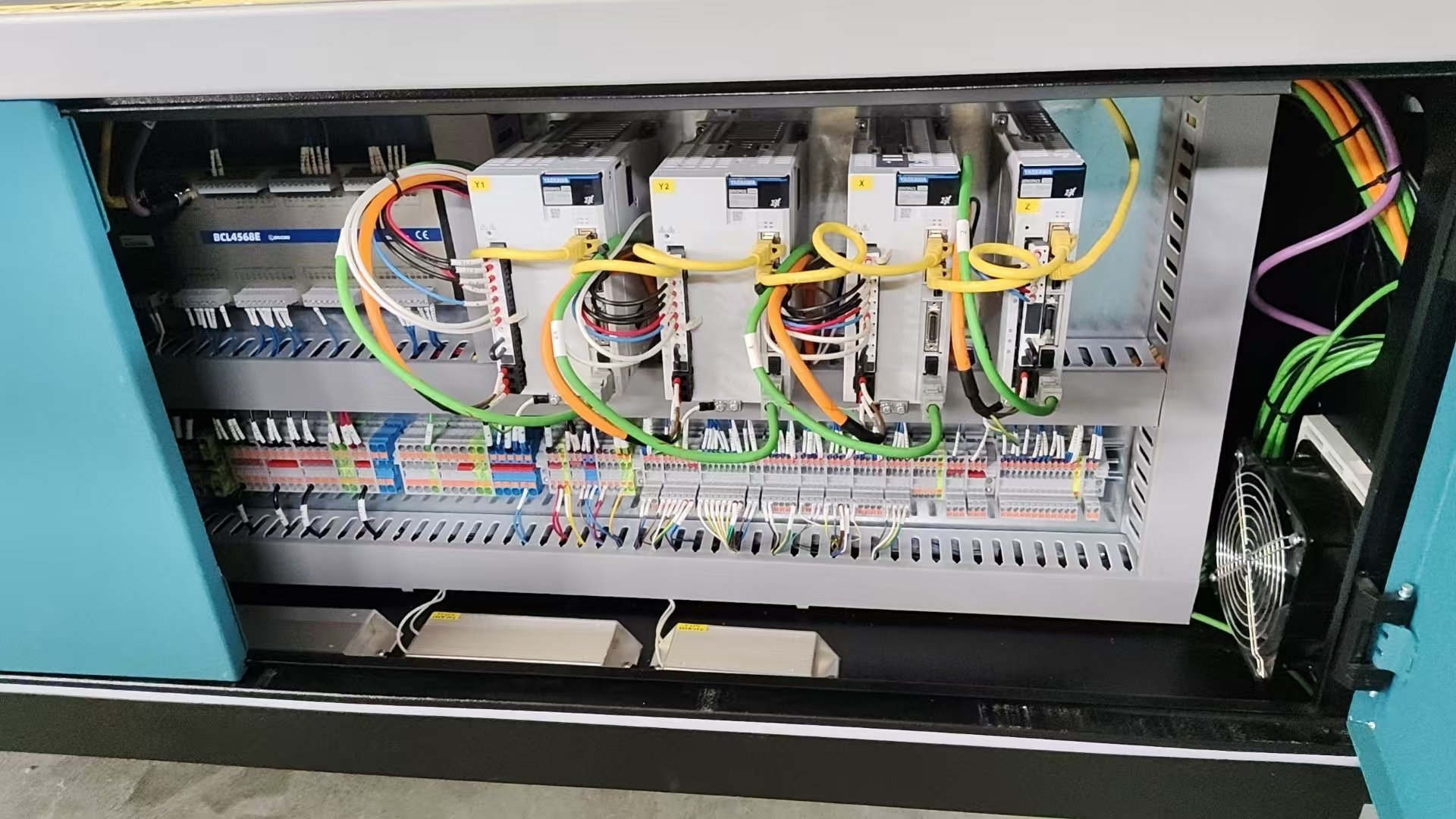 a piece of metal being cut with a machine