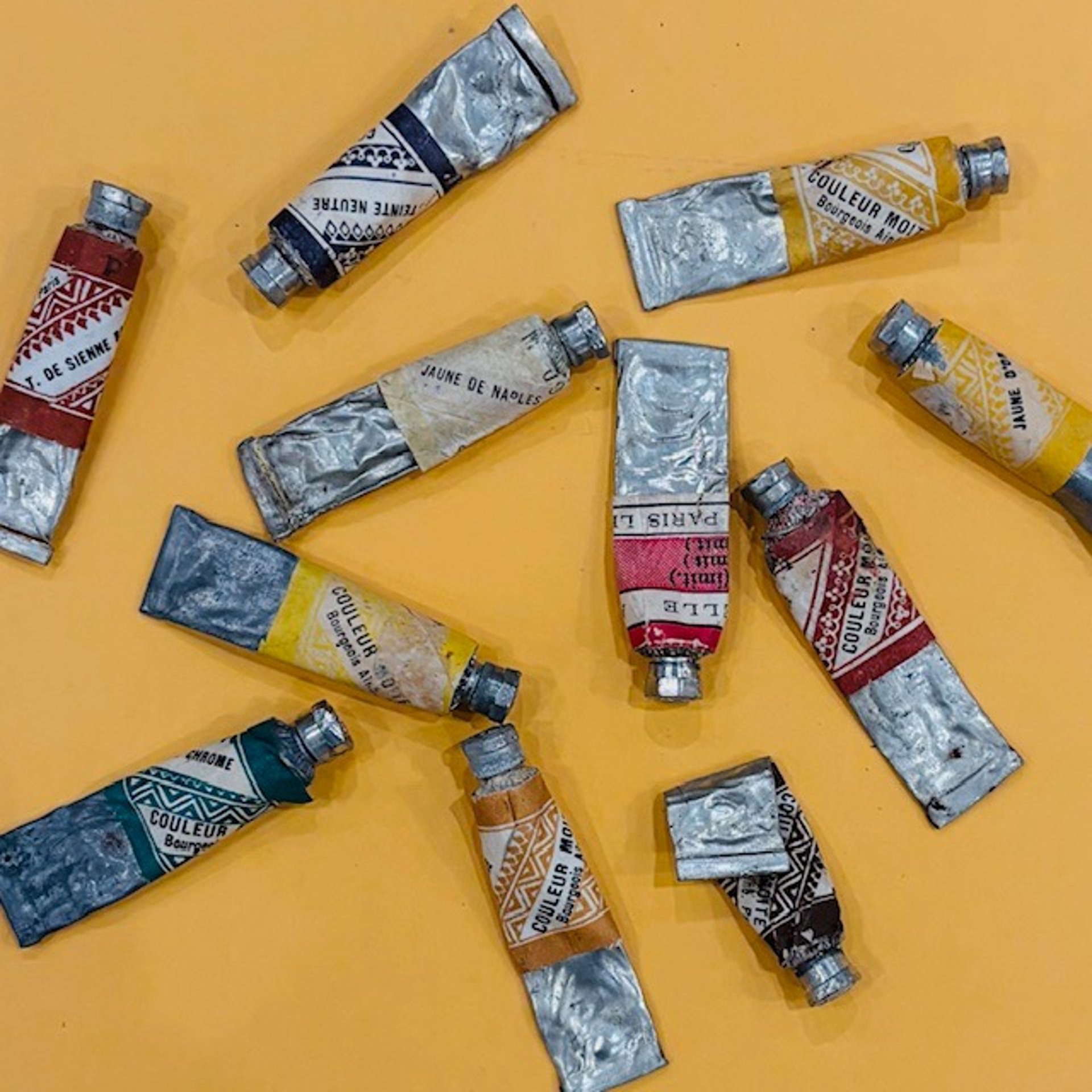 woman wearing yellow long-sleeved dress under white clouds and blue sky during daytime