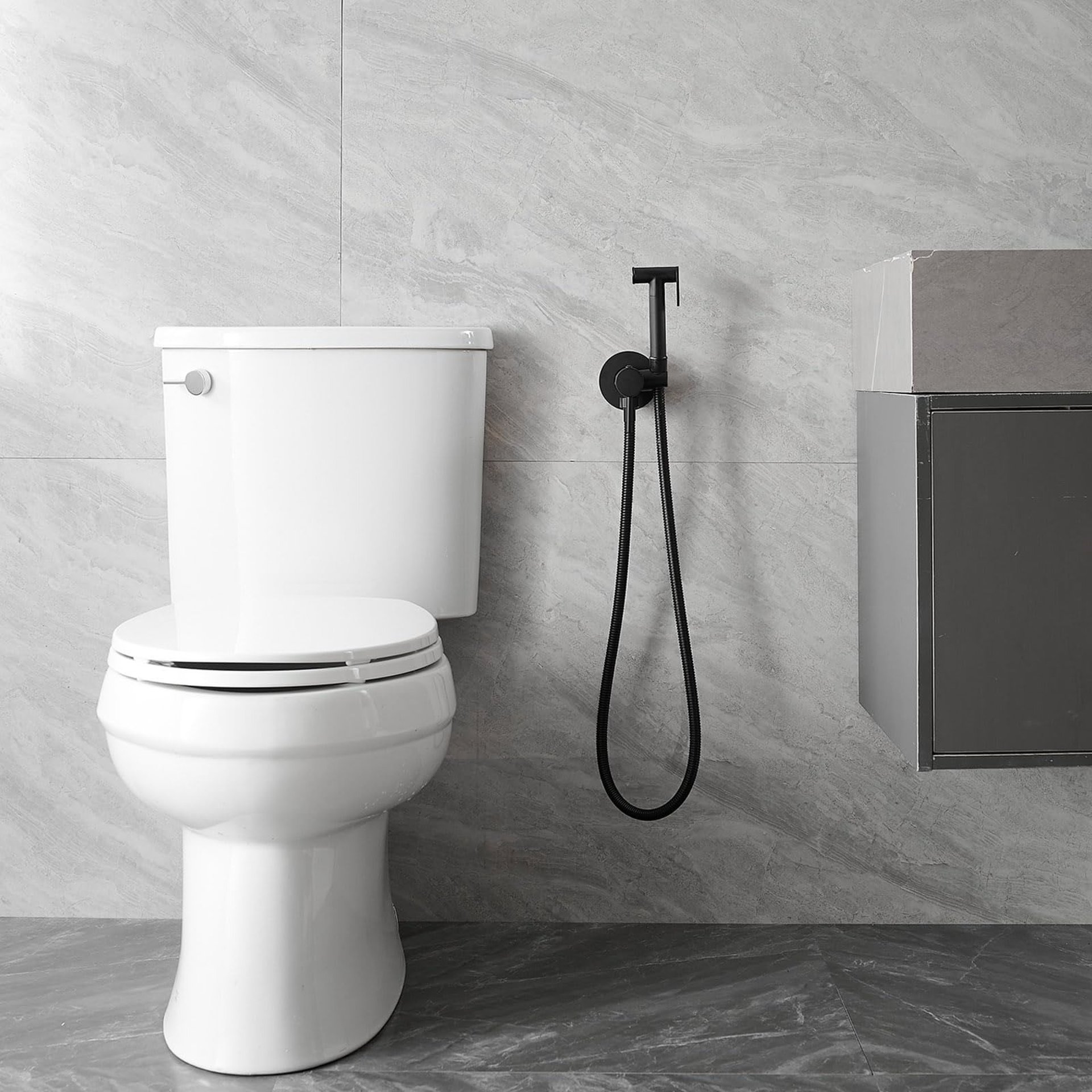 a bathroom with a toilet, sink, and bathtub