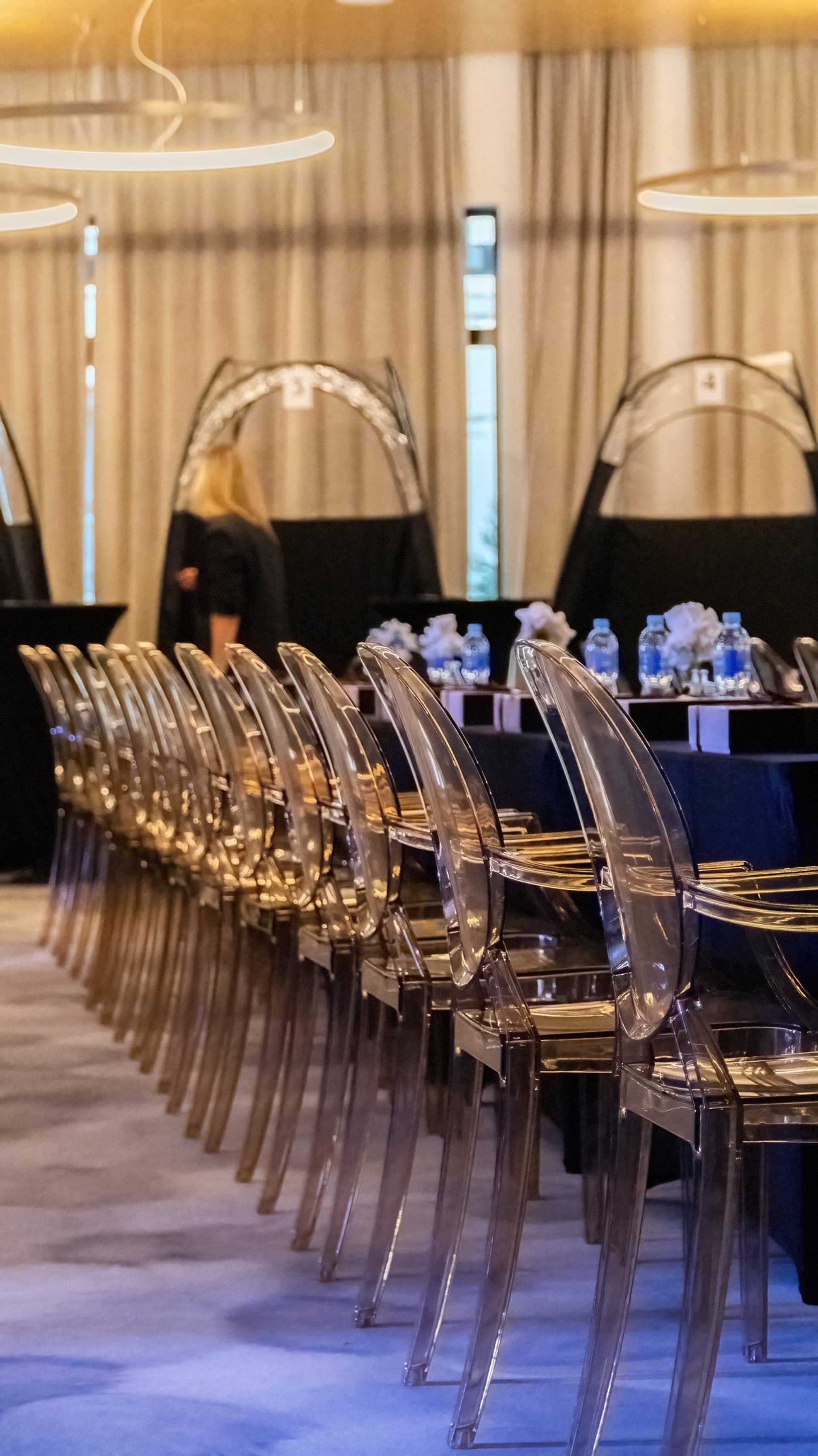 an abstract photo of a curved building with a blue sky in the background