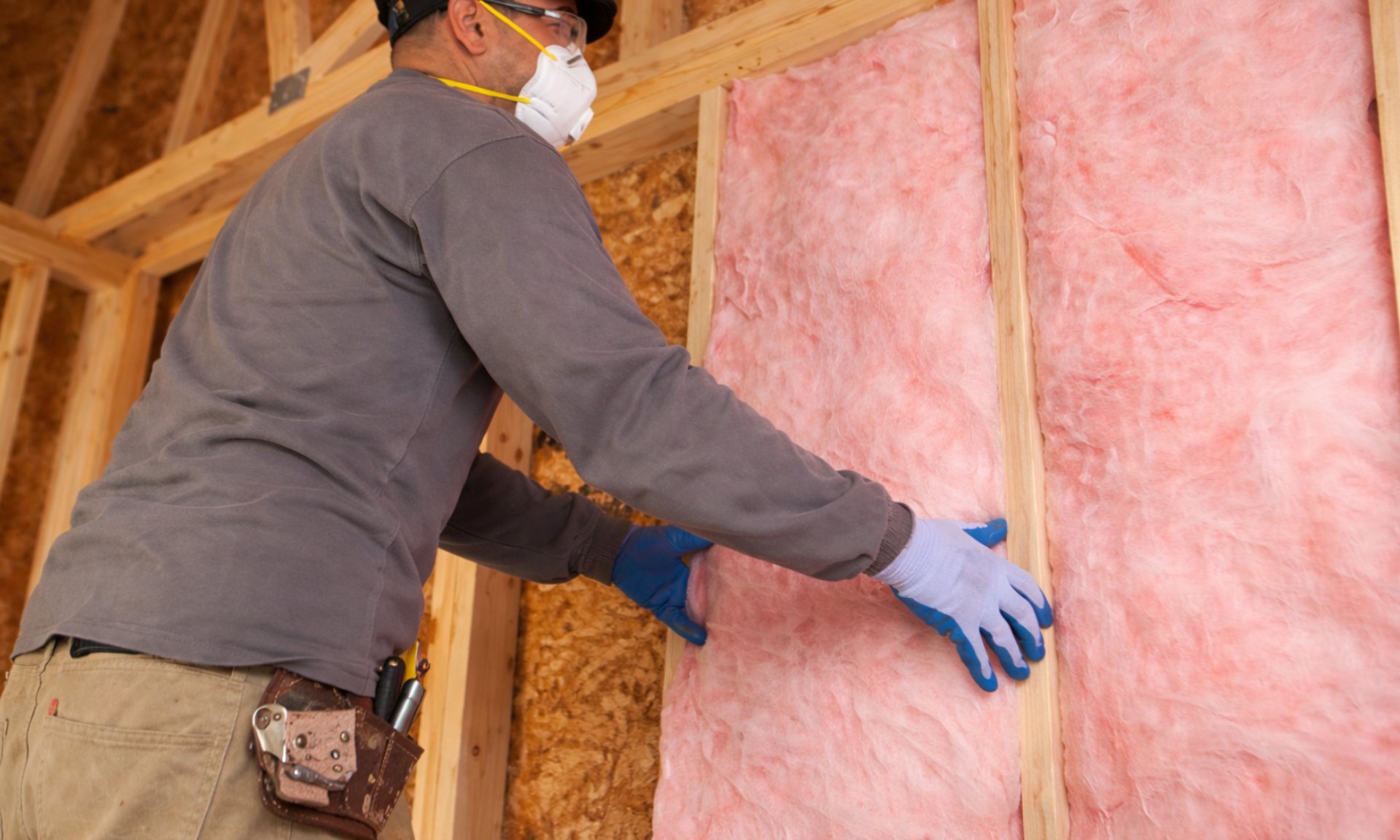 person in blue pants sitting on brown wooden floor