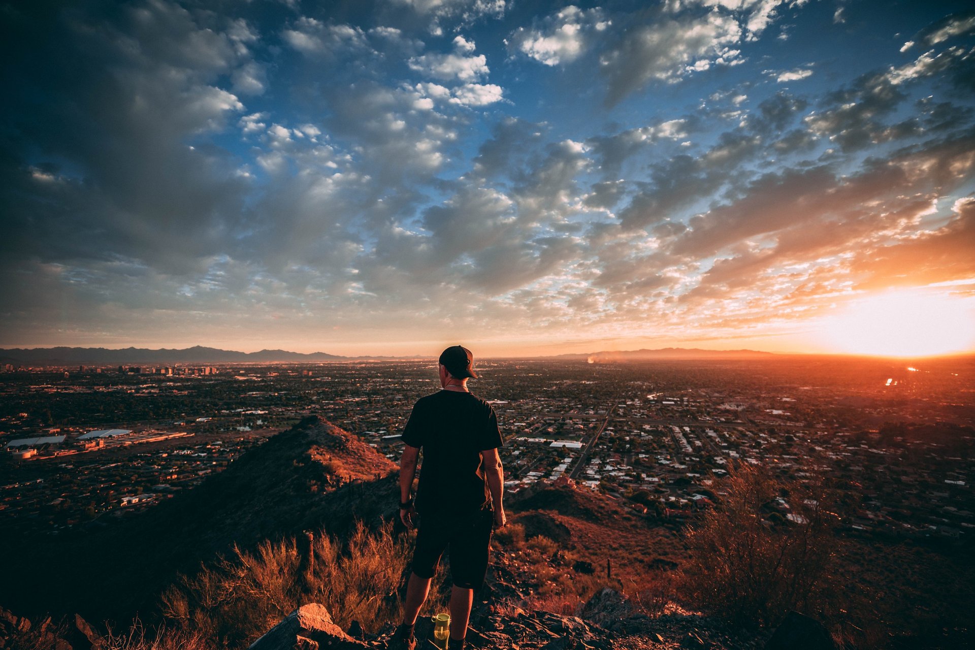 an abstract photo of a curved building with a blue sky in the background
