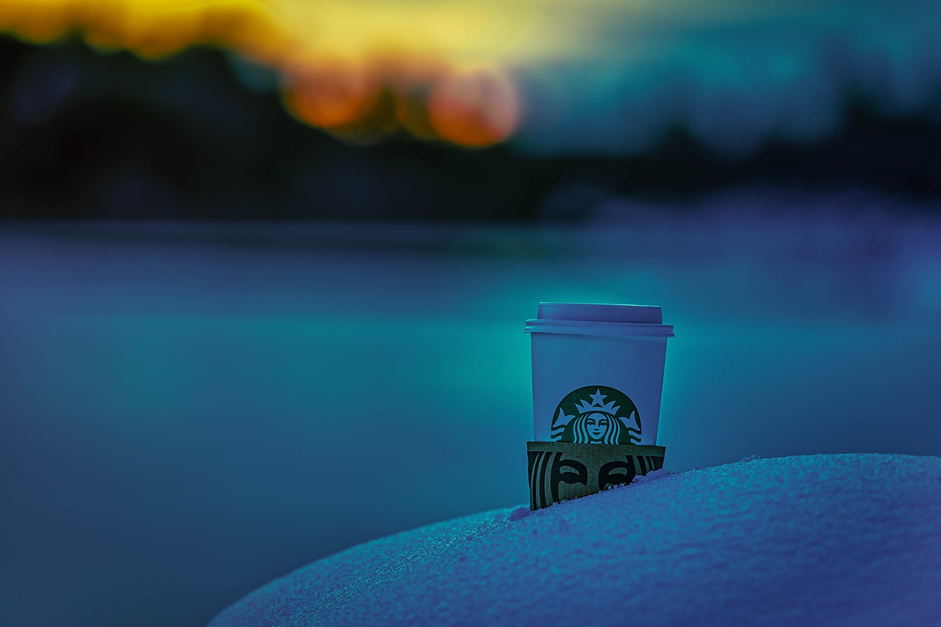 an abstract photo of a curved building with a blue sky in the background