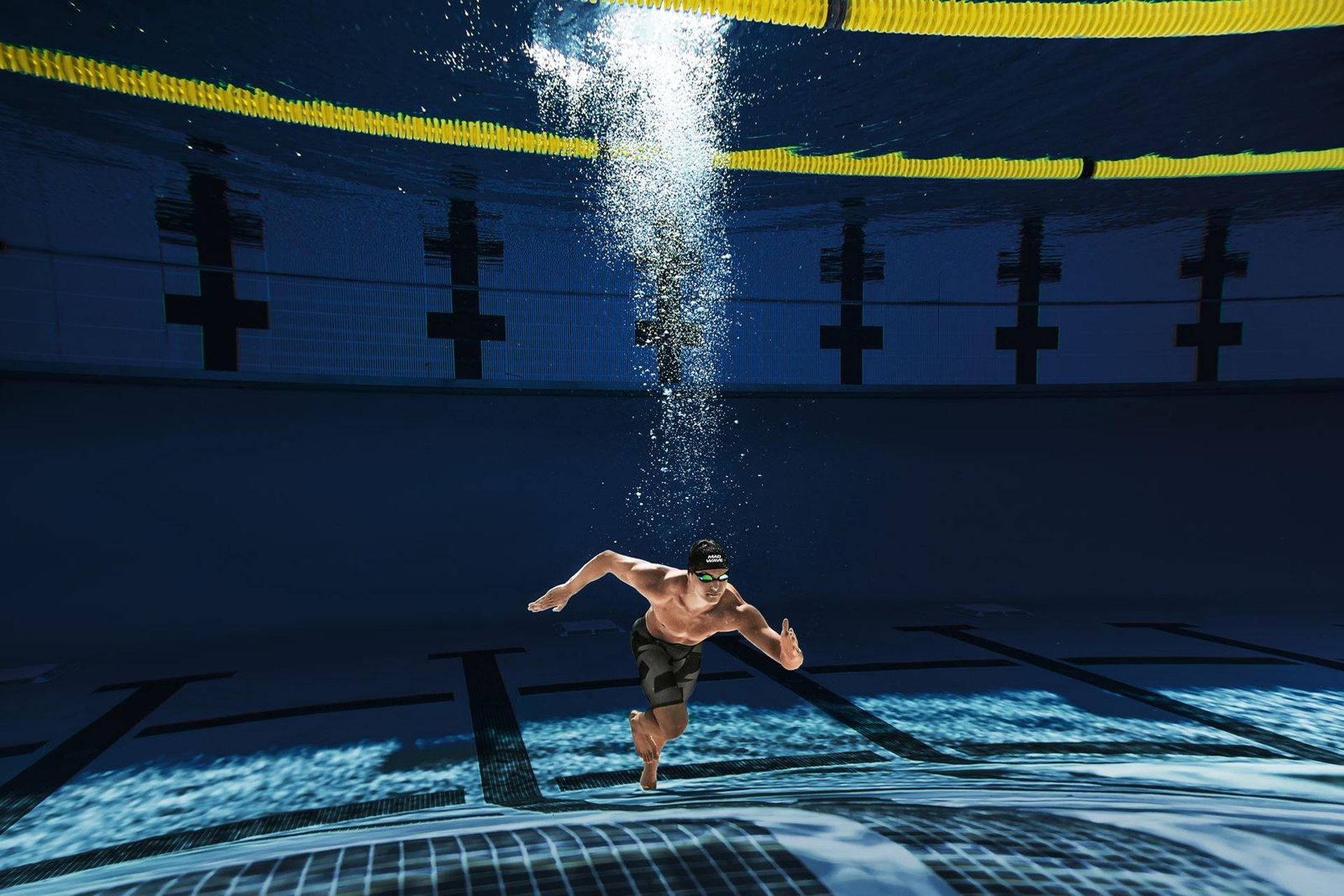 an abstract photo of a curved building with a blue sky in the background