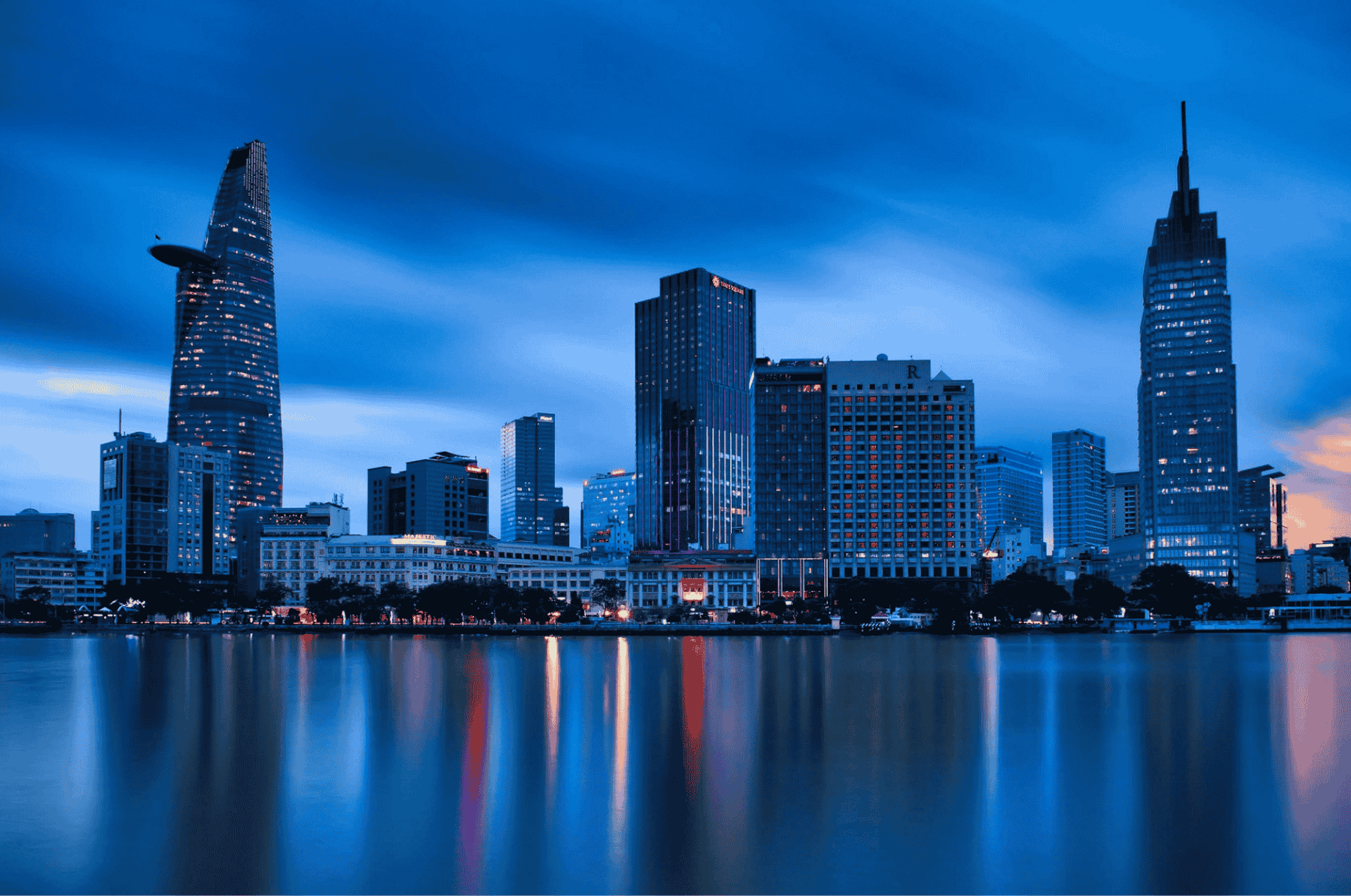 person riding on skis during winter surrounded by mountains