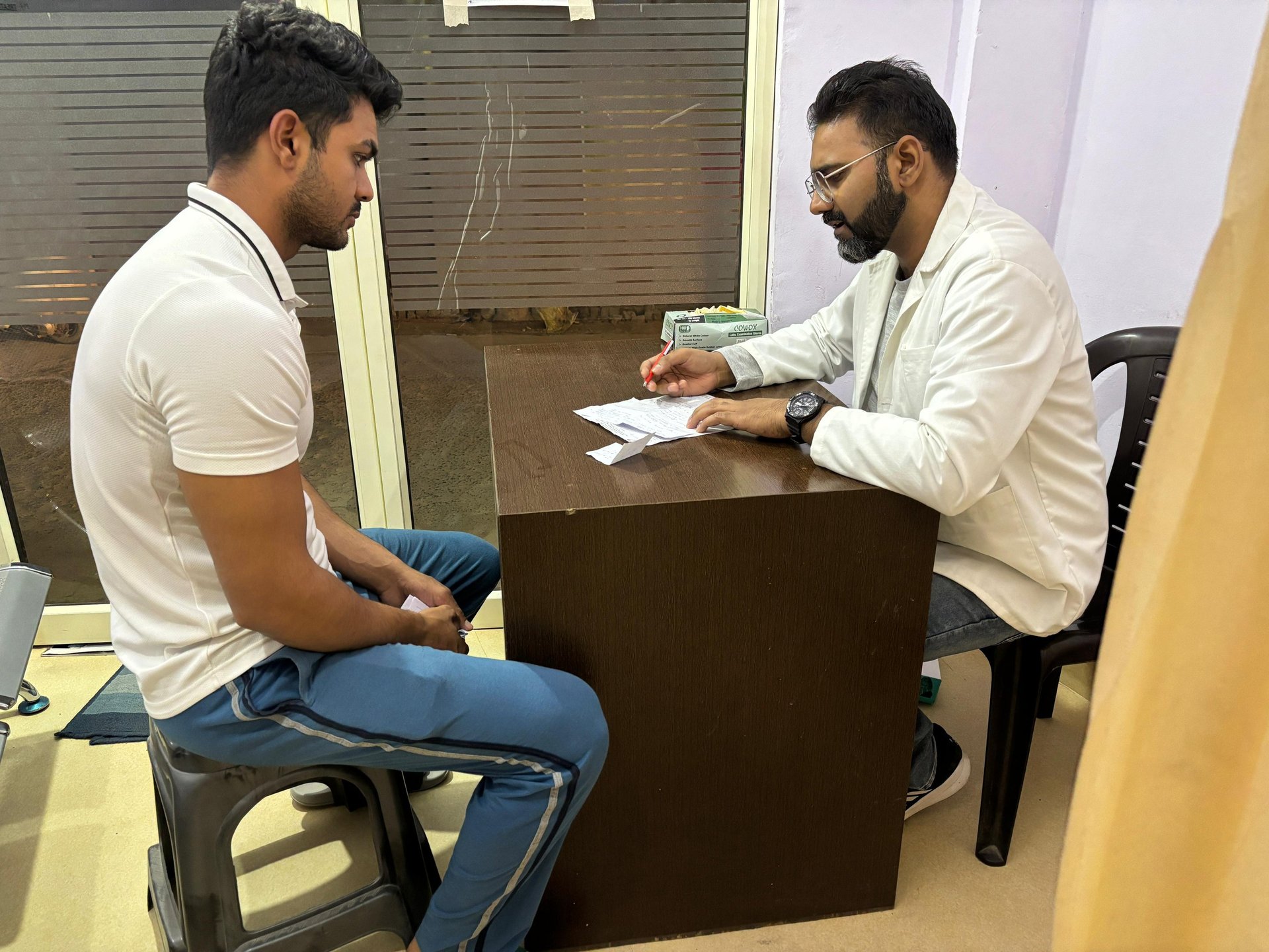person holding black knit cap