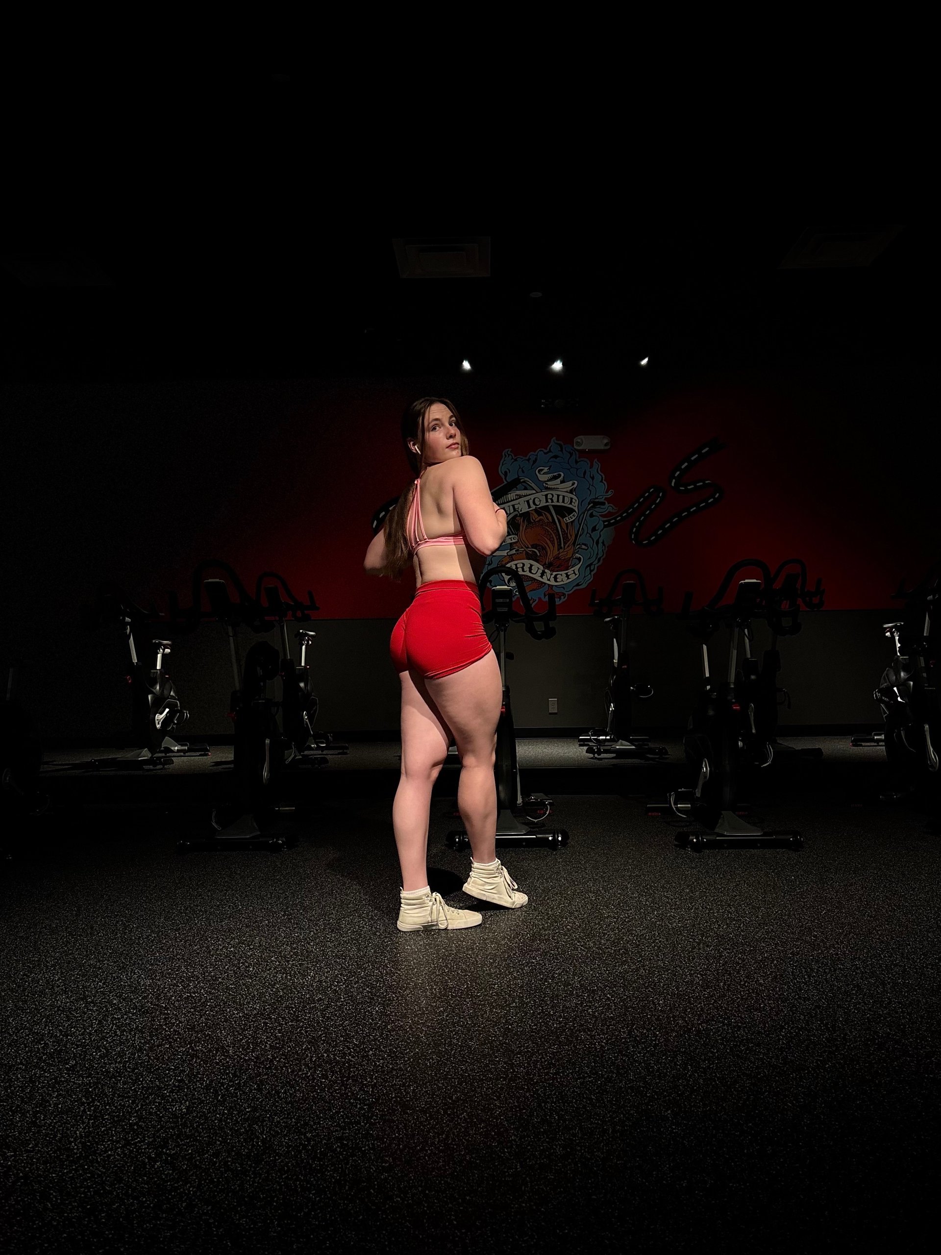 an abstract photo of a curved building with a blue sky in the background