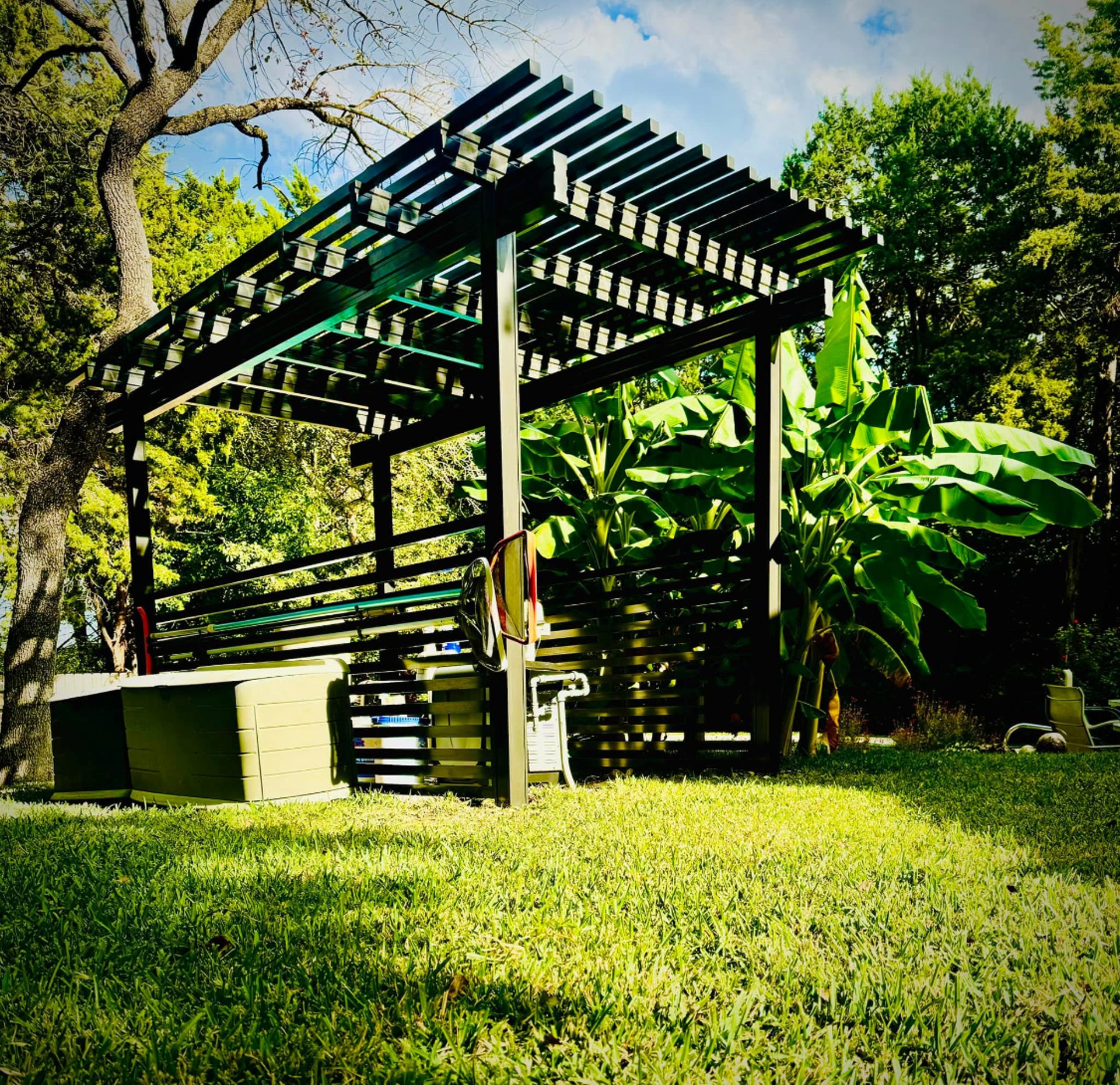 an abstract photo of a curved building with a blue sky in the background