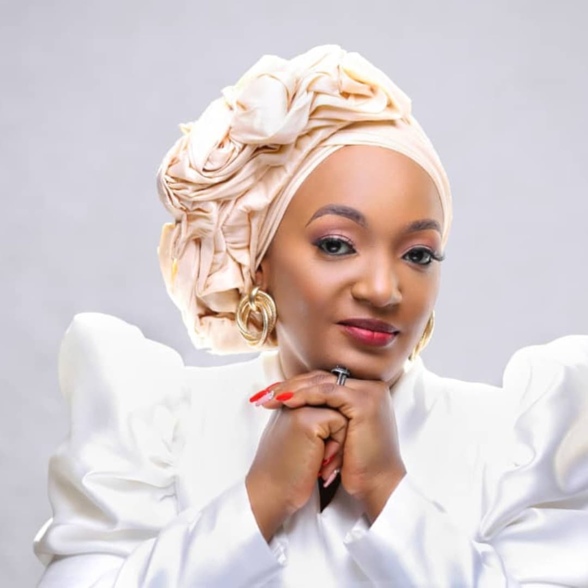 an abstract photo of a curved building with a blue sky in the background