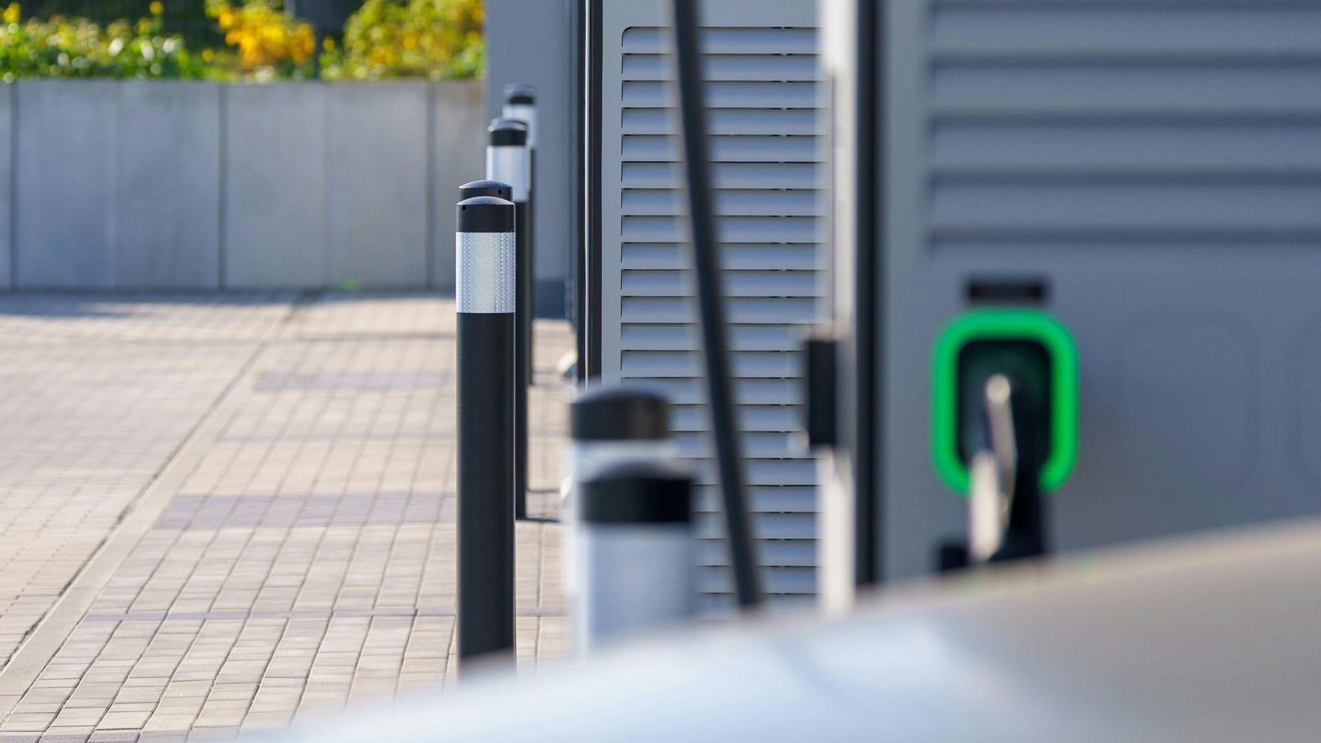 an abstract photo of a curved building with a blue sky in the background