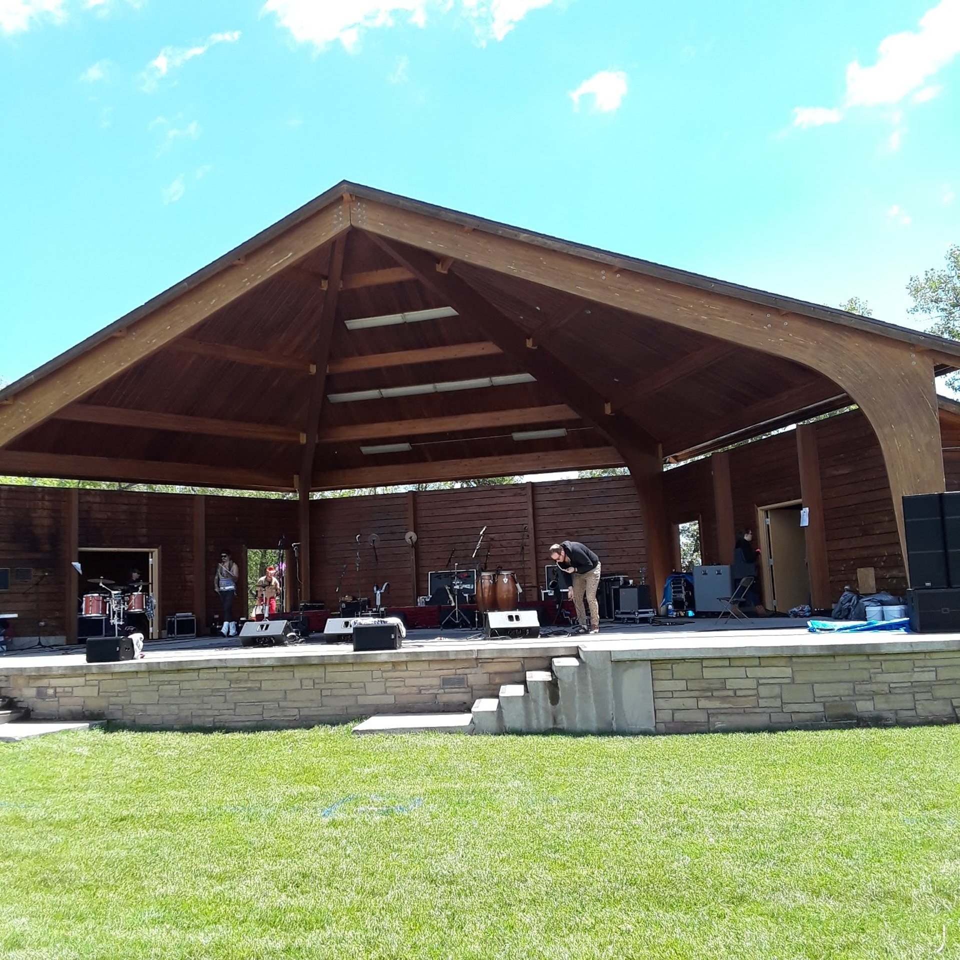woman wearing yellow long-sleeved dress under white clouds and blue sky during daytime
