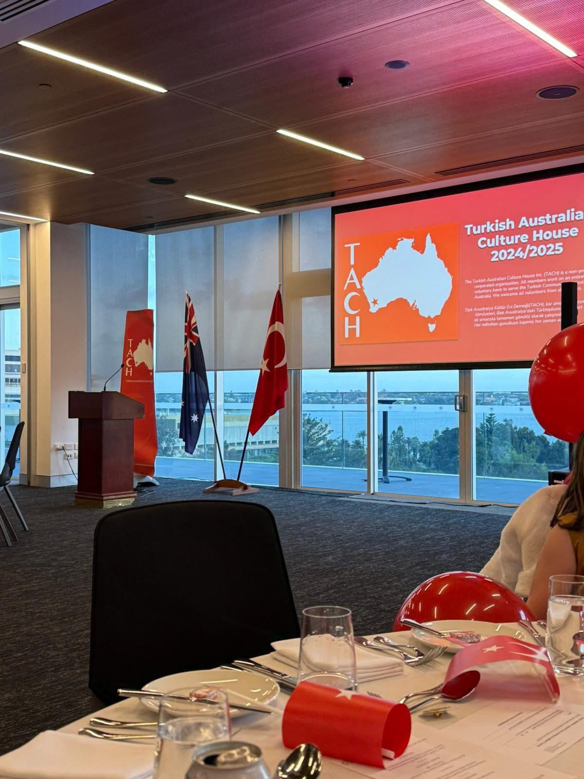 an abstract photo of a curved building with a blue sky in the background