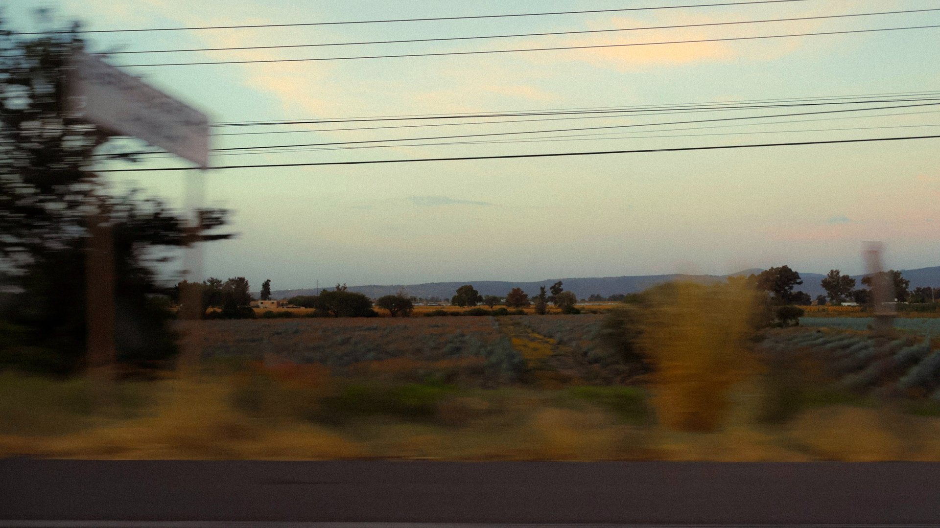 an abstract photo of a curved building with a blue sky in the background