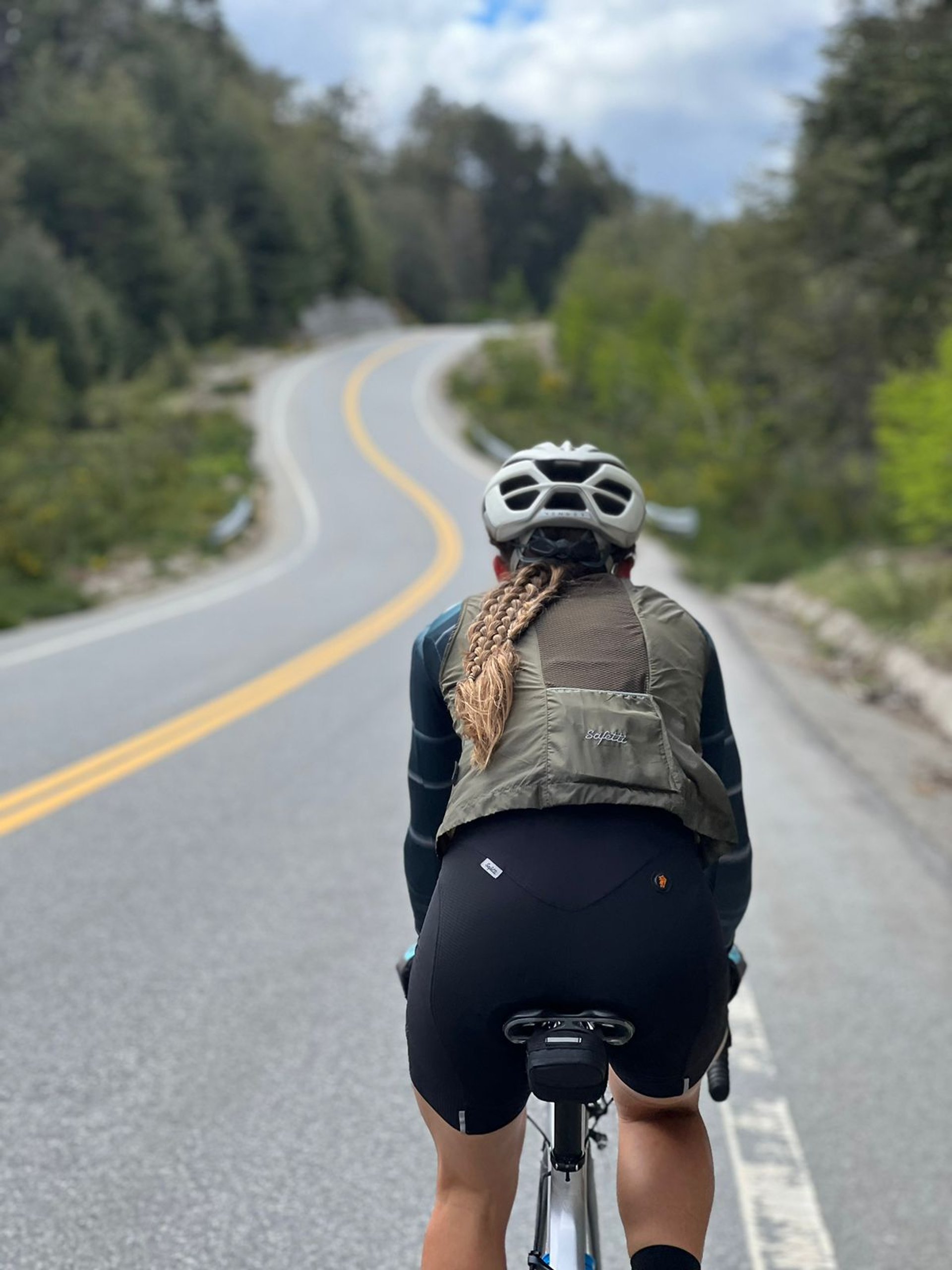 cyclist on road during golden hour