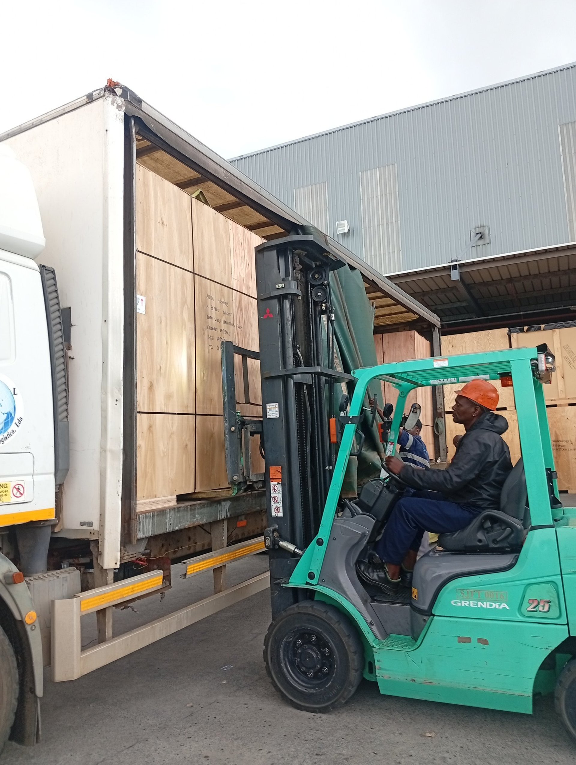 woman wearing yellow long-sleeved dress under white clouds and blue sky during daytime