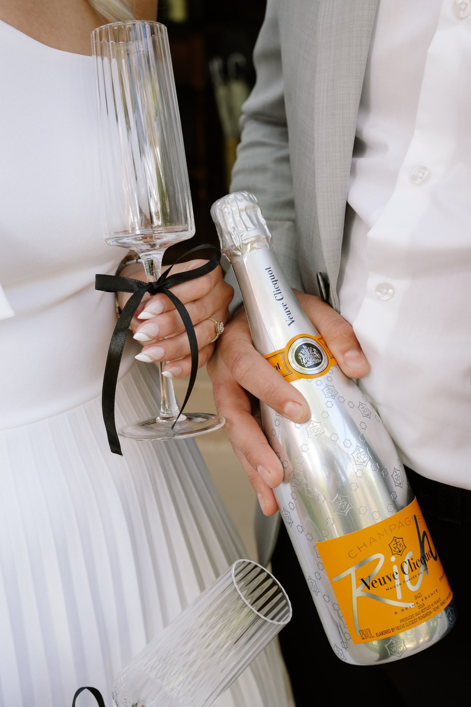 couple wearing silver-colored rings