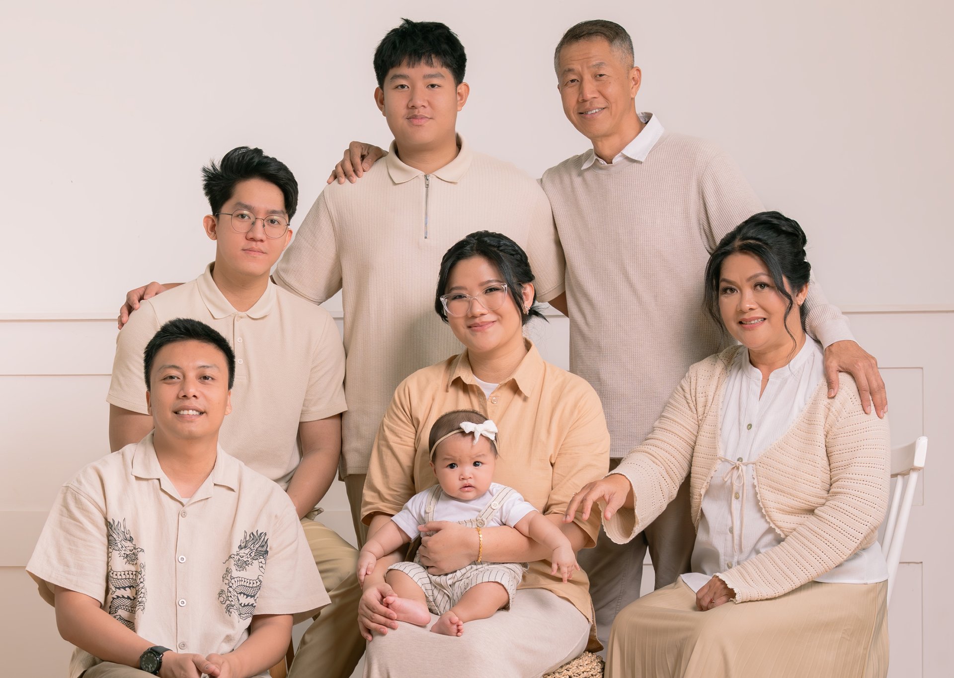 couple walking barefoot with a child at the garden