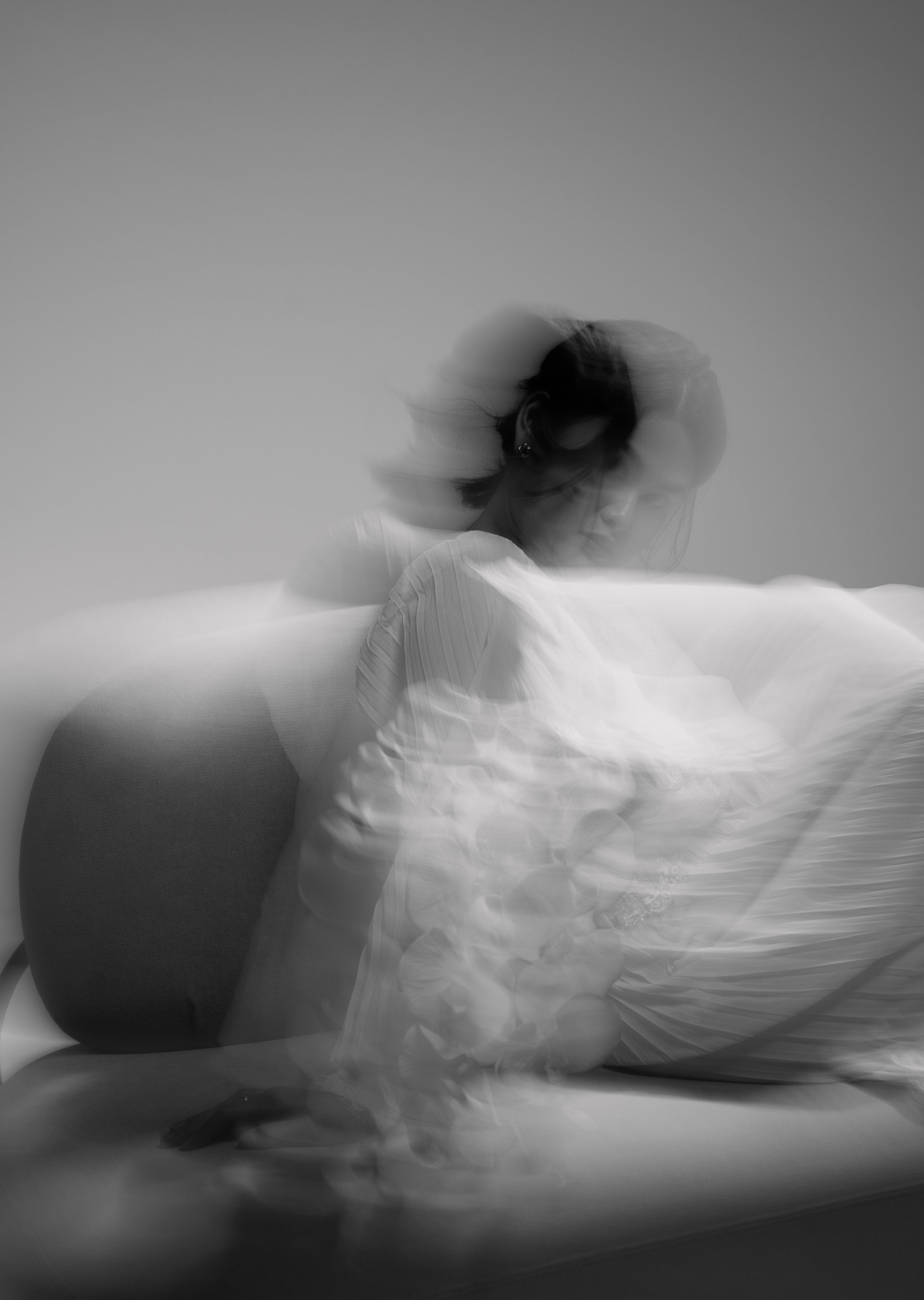 couple walking barefoot with a child at the garden