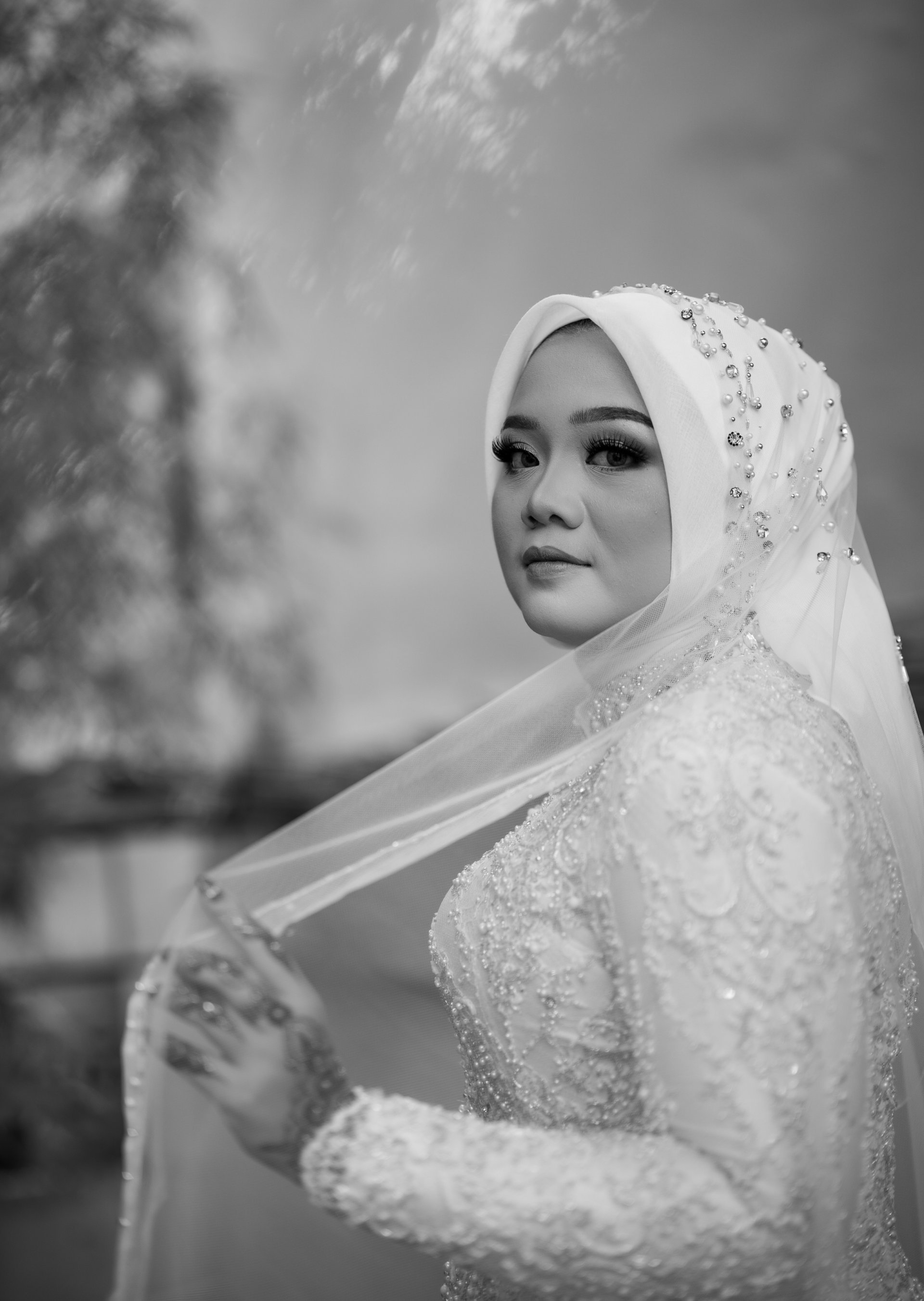 couple walking barefoot with a child at the garden