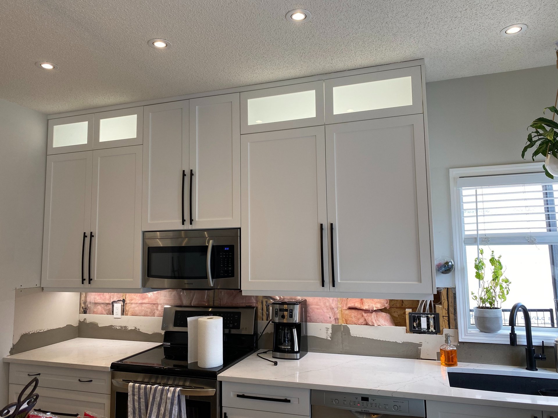 white bathtub with shower curtain