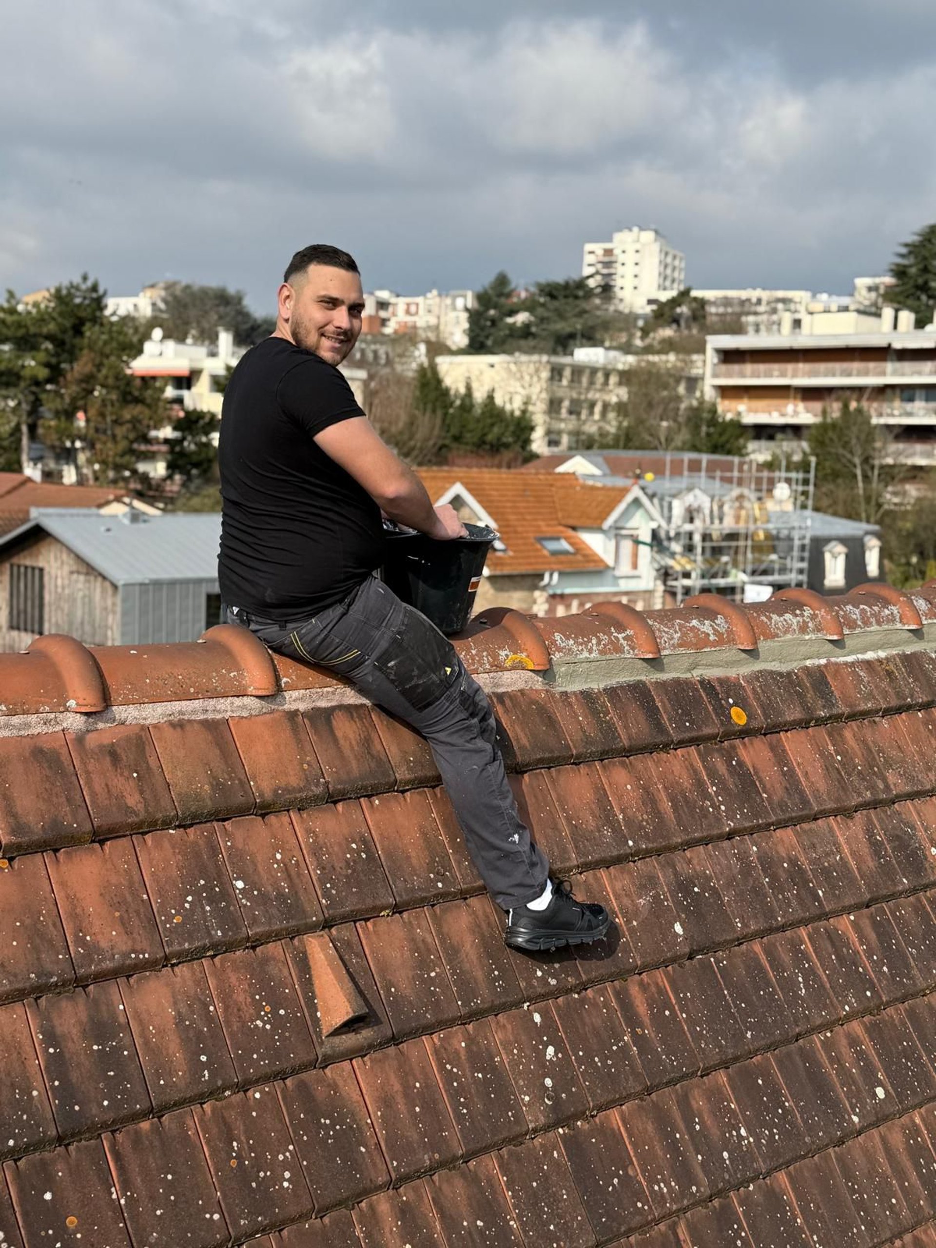 a person wearing blue gloves and holding a hammer