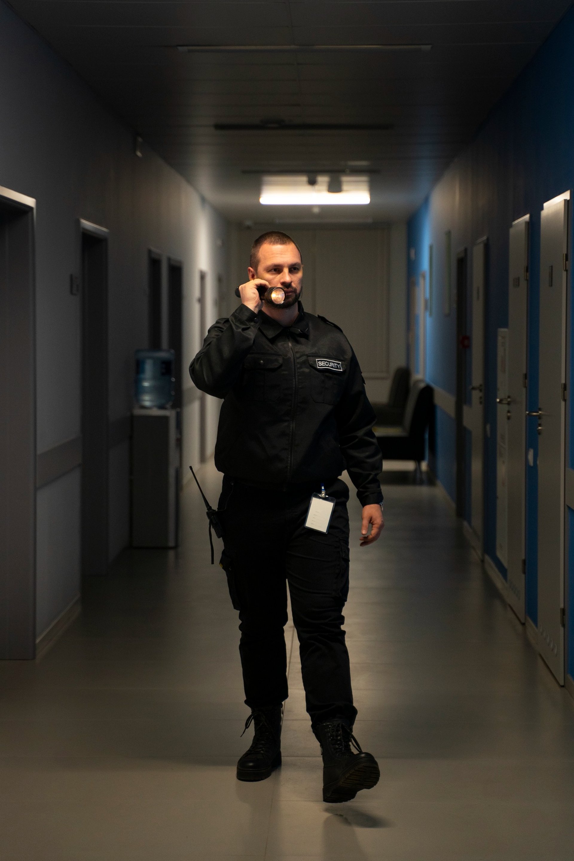 security guard standing on the gray floor