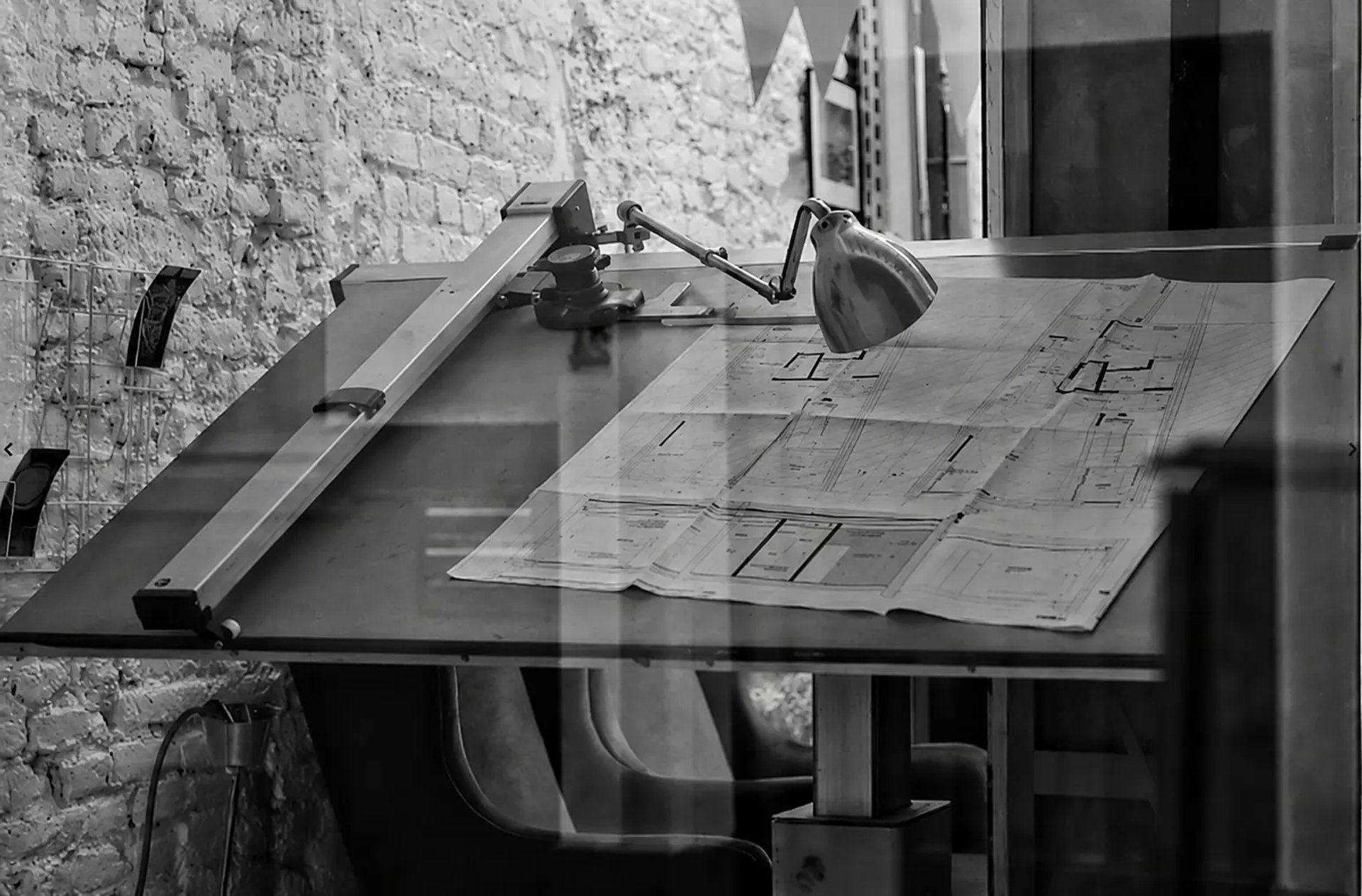 grayscale photo of chair and table