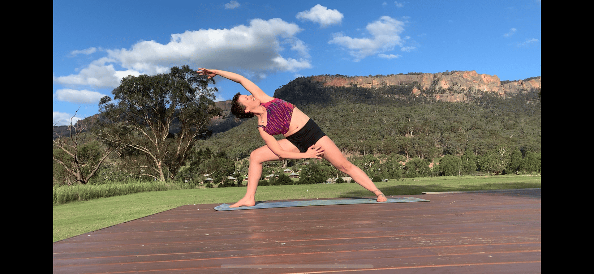 woman wearing yellow long-sleeved dress under white clouds and blue sky during daytime