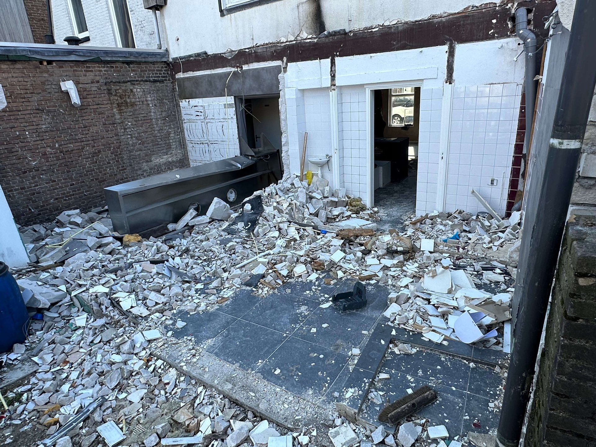 an abstract photo of a curved building with a blue sky in the background