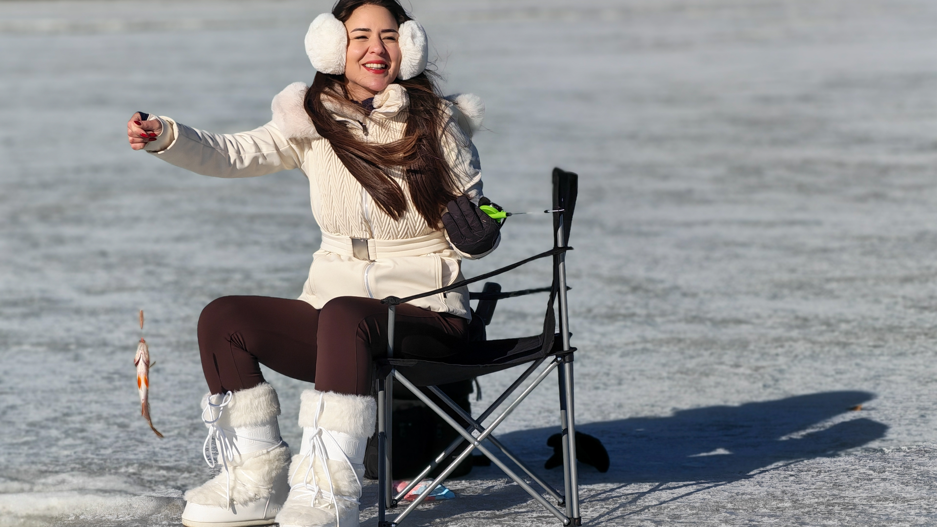 person riding on skis during winter surrounded by mountains