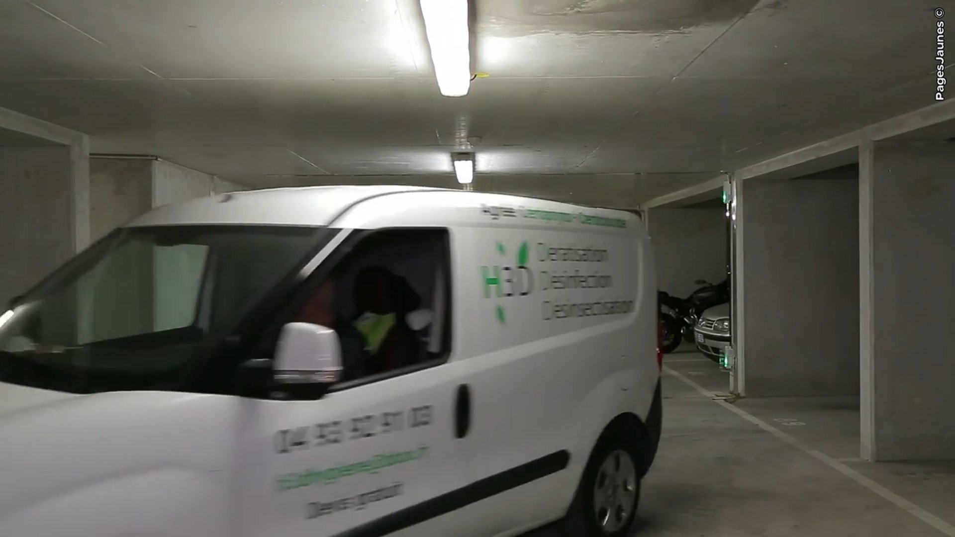 A man sanding a wooden table with a sander