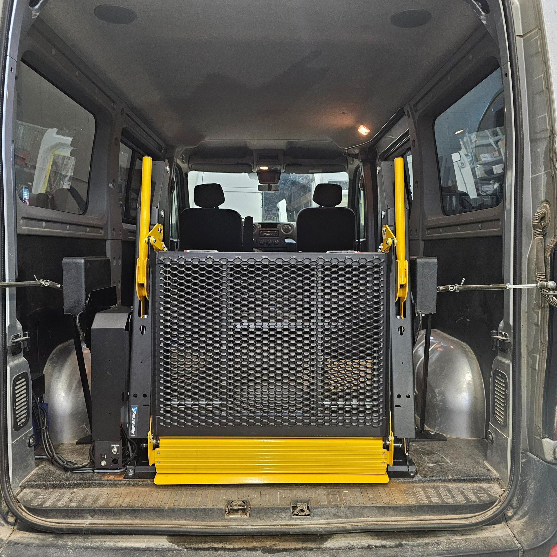 an abstract photo of a curved building with a blue sky in the background