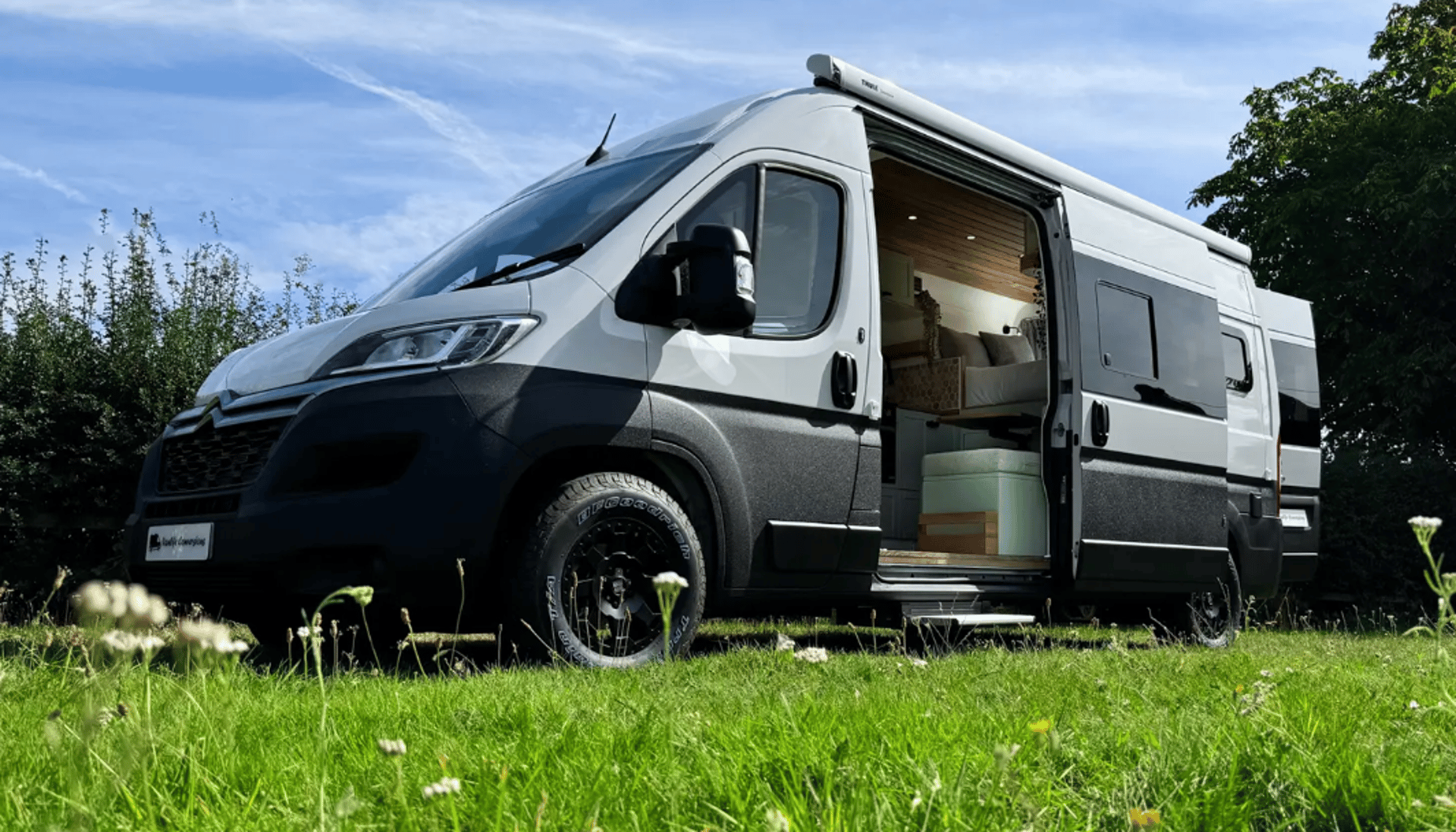 an abstract photo of a curved building with a blue sky in the background